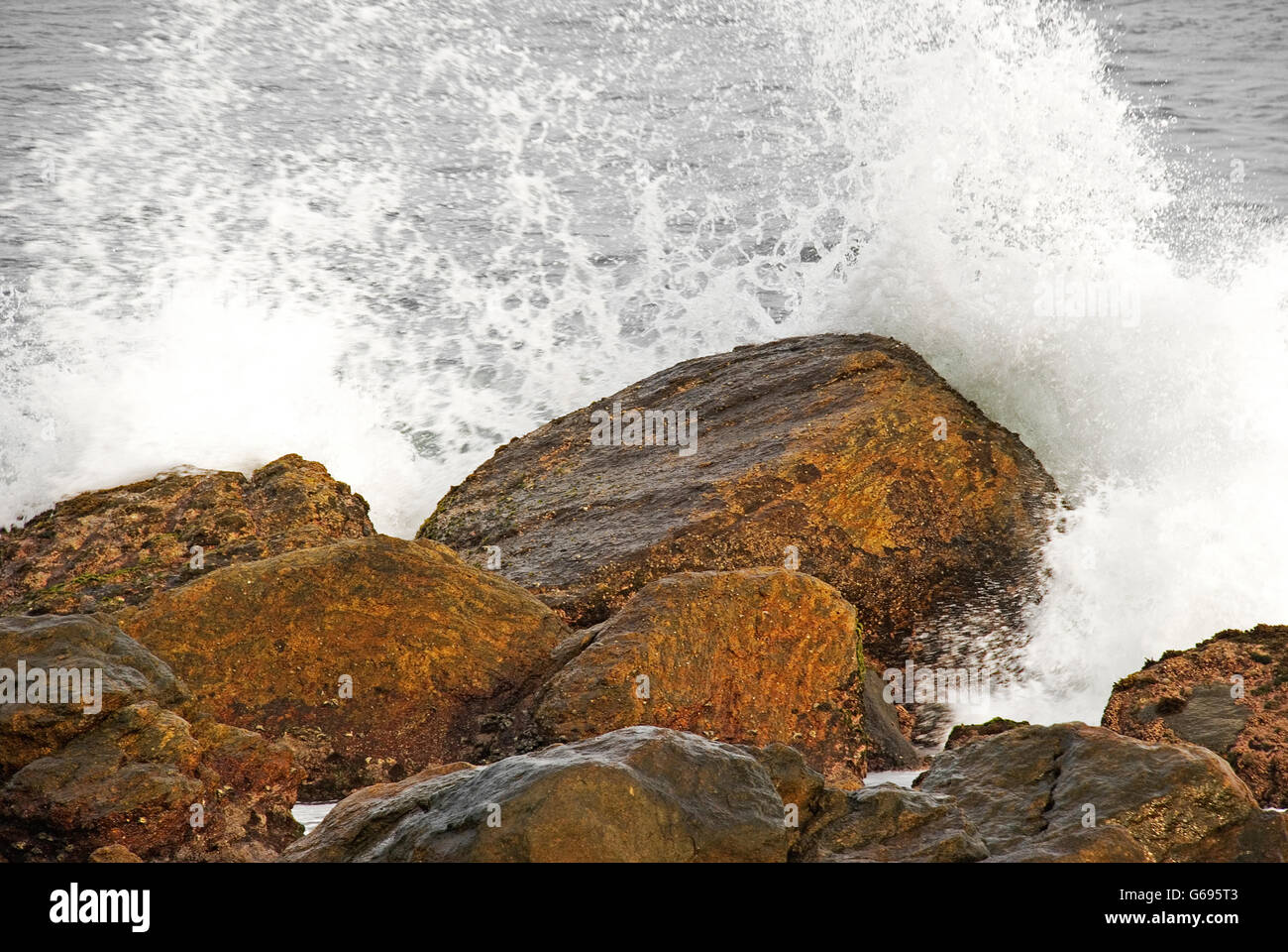 Waves splash over the rocks, Indian Ocean, Kanyakumari, Tamil Nadu, India Stock Photo