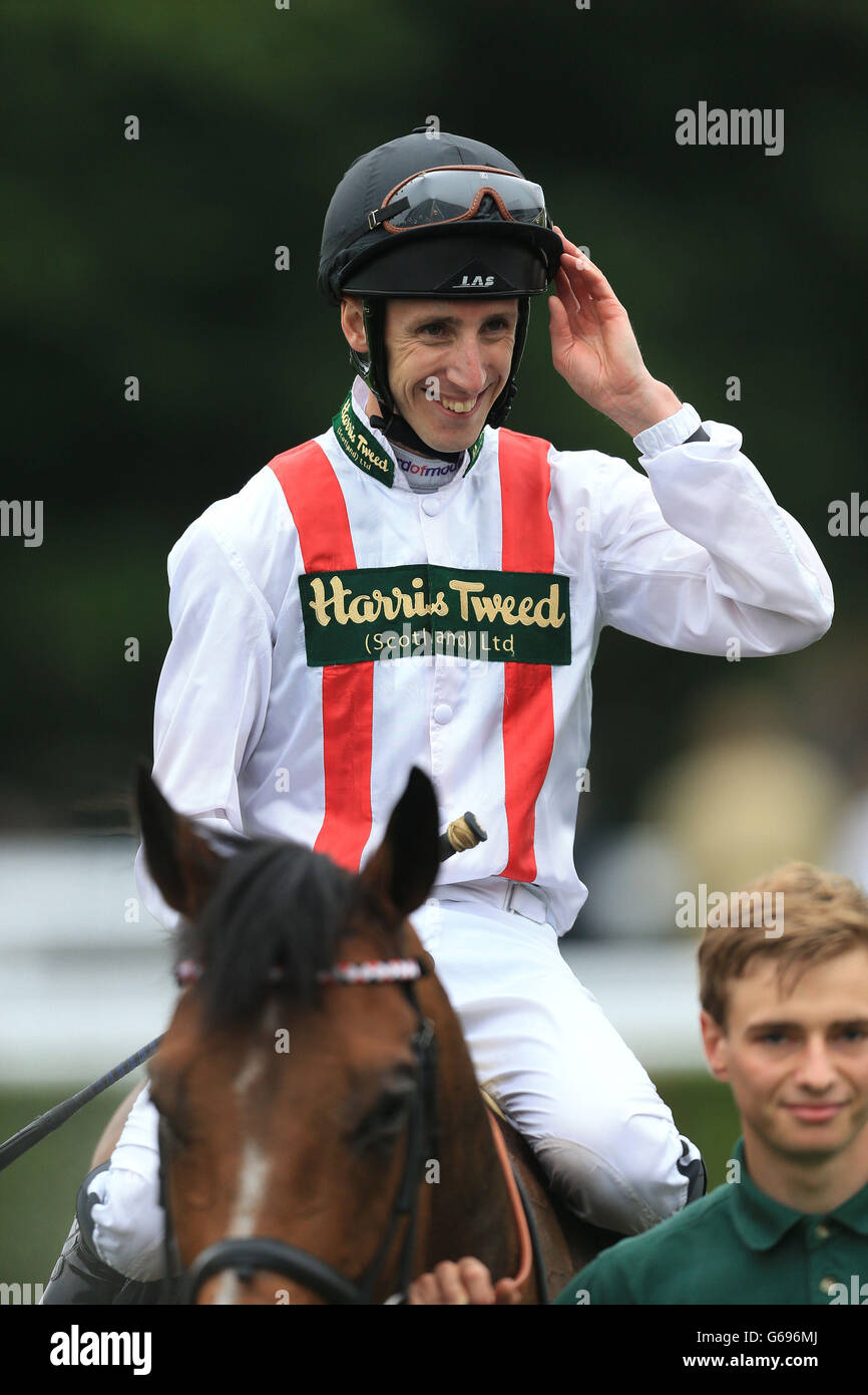 Jockey Baker salutes the crowd after winning onboard Harris