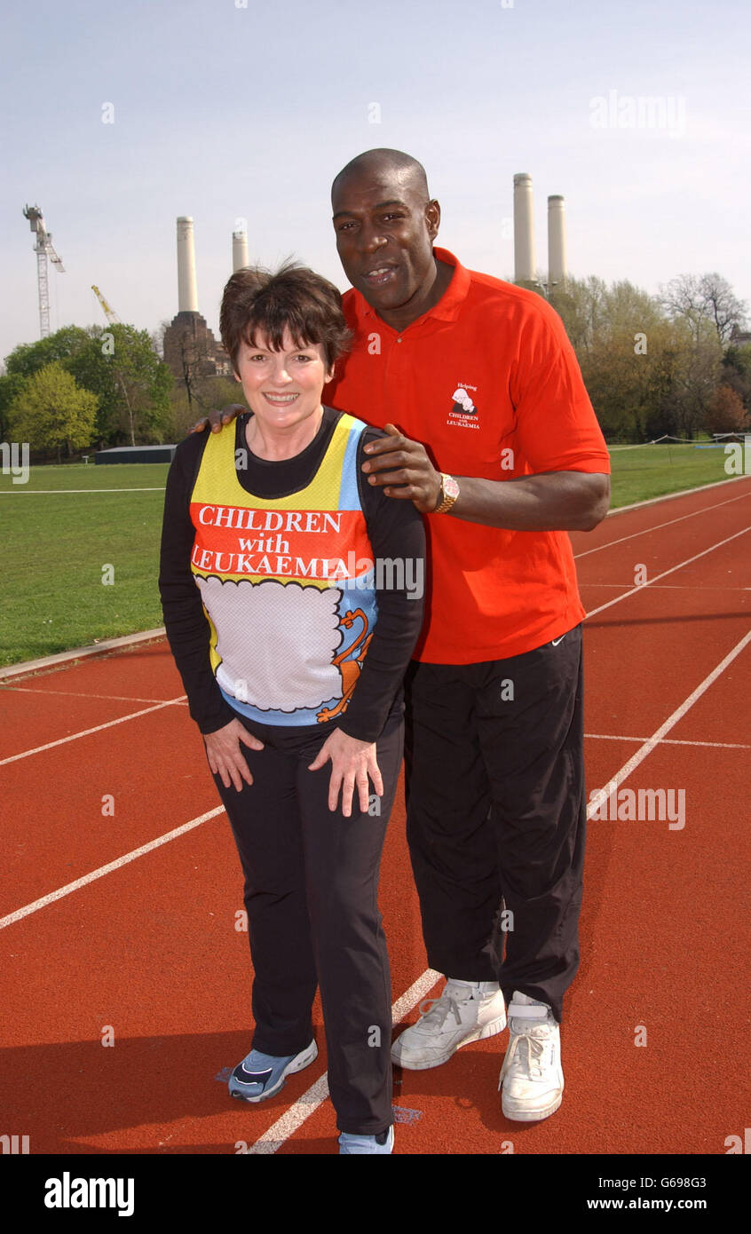 Former boxer Frank Bruno gives actress Brenda Blethyn a piggy back during a photocall to launch the 'Children with Leukaemia' official 2002 Flora London Marathon charity team at the Millennium Arena, Battersea Park, London. Stock Photo