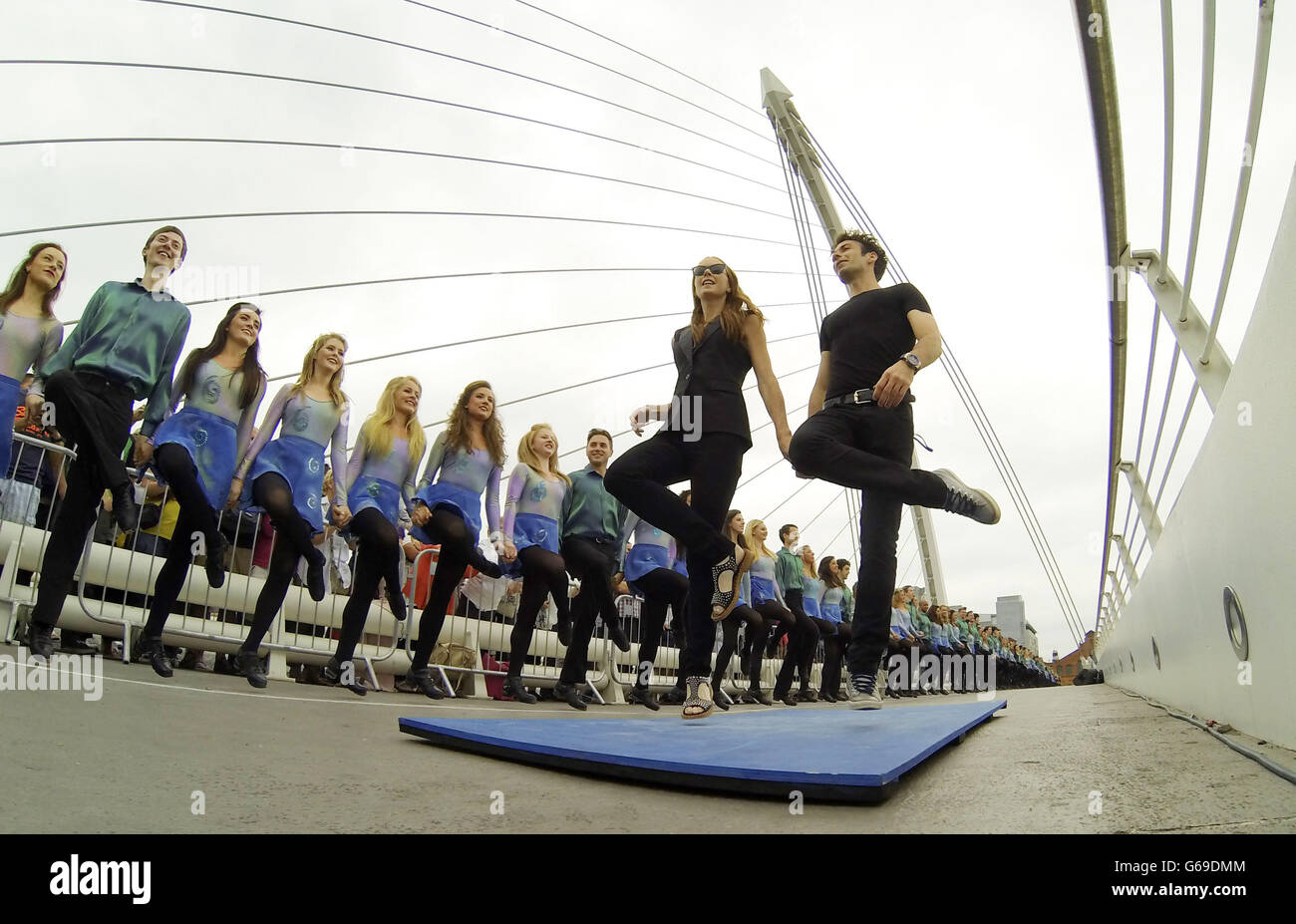 Photo. Jean Butler and Padraic Moyles lead the cast of Riverdance on Samuel Beckett Bridge, during the world record attempt for the longest line of Irish dancers in Dublin. Stock Photo