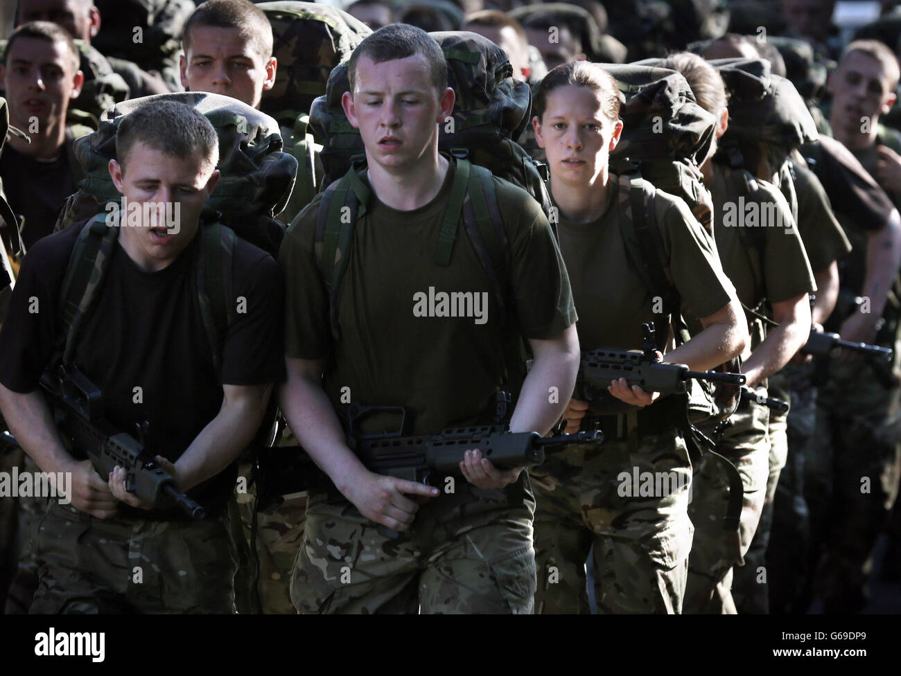Army Reserve recruits taking part in a cross country run exercise in the Pentland Hills, near Edinburgh, testing their skill in how to survive out in the field on one of the hottest days of the year. Stock Photo
