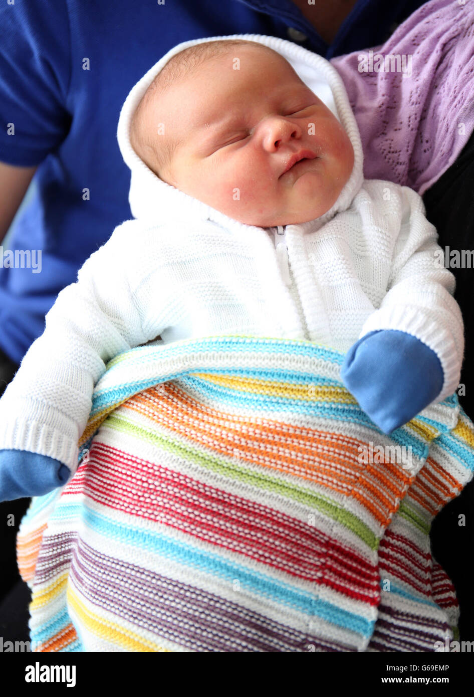 First time parents Carleen and Conor Maginn, from Crumlin in Co Antrim, with son James, who was born yesterday on the same day as The Duke and Duchess of Cambridge's son, weighing 8Lb 10 oz, at the Royal Victoria hospital, in Belfast. Stock Photo