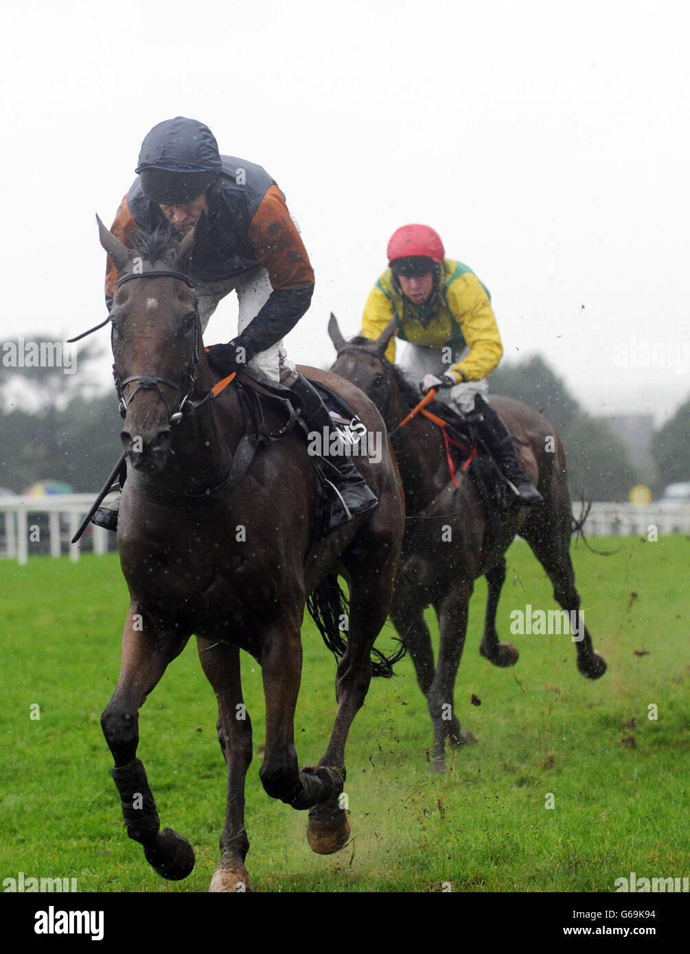 Jockey Barry Geraghty (left) rides Rebel Fitz to victory in the Guinness Mid-Strength Novice Steeplechase during day four of the 2013 Galway Summer Festival at Galway Racecourse, Ballybrit, Ireland. Stock Photo