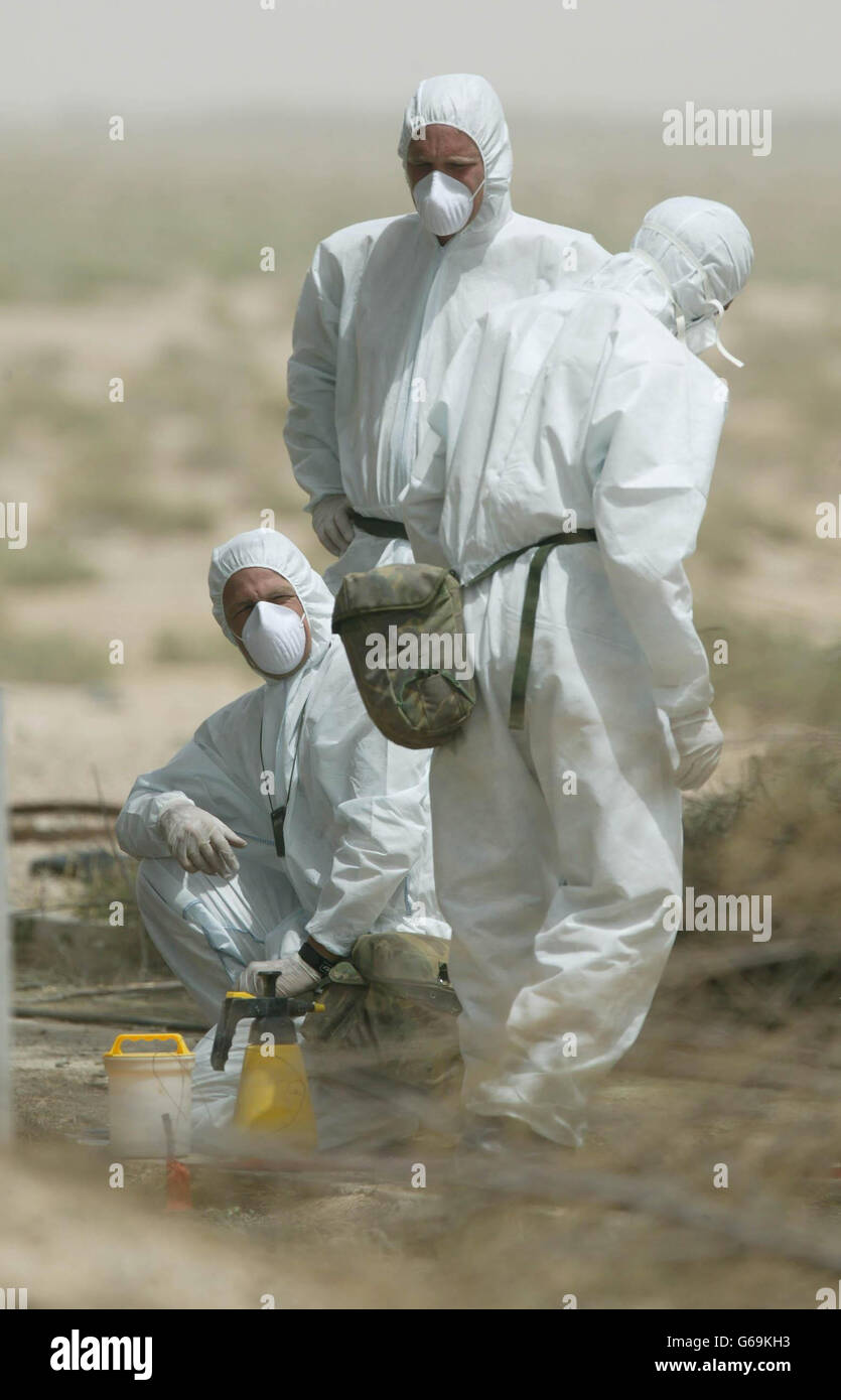 Picture made available of Army chemical weapons experts examining one of `Chemical Ali's' former bases near Basra where initial examinations show signs of suspicious chemicals. PA Photo/Dan Chung/The Gaurdian/MoD Pool. Stock Photo