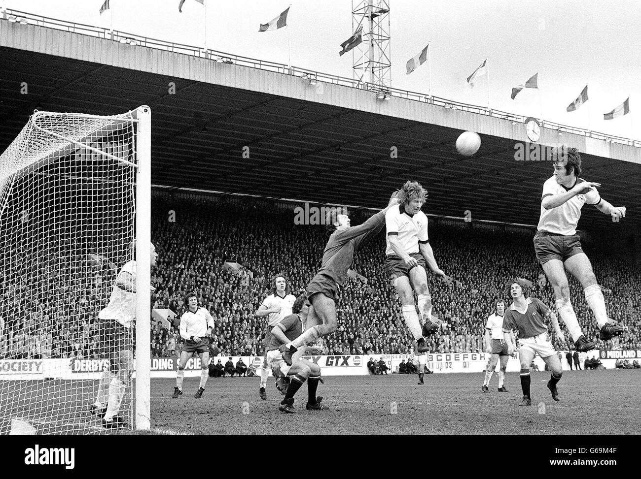 Archie Gemmill watches his goalkeeper Graham Moseley go out to clear ball from a Man Utd attack during the FA Cup semi-final at Hillsborough. Stock Photo