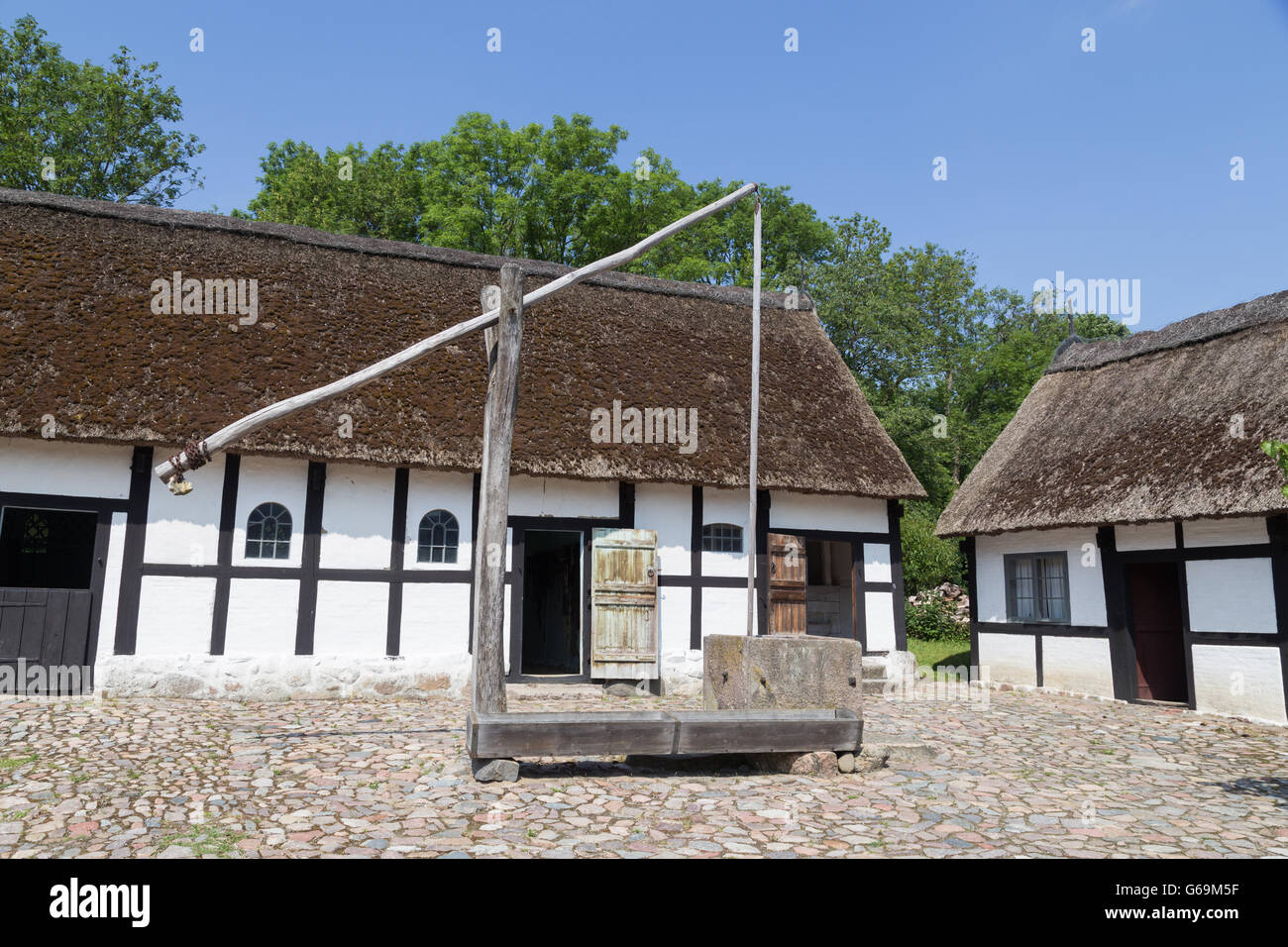 Lyngby, Denmark - June 23, 2016: Sweep well in courtyard of old danish farmhouse. Stock Photo