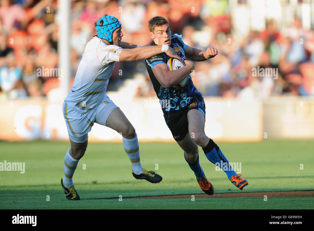 Exeter Chiefs 7's Chris Elder is tackled by Worcester Warriors 7's Richard De Carpentier during the Group A match of the J.P. Morgan Asset Management Premiership Rugby 7's at Kingsholm Stadium, Gloucester. Stock Photo