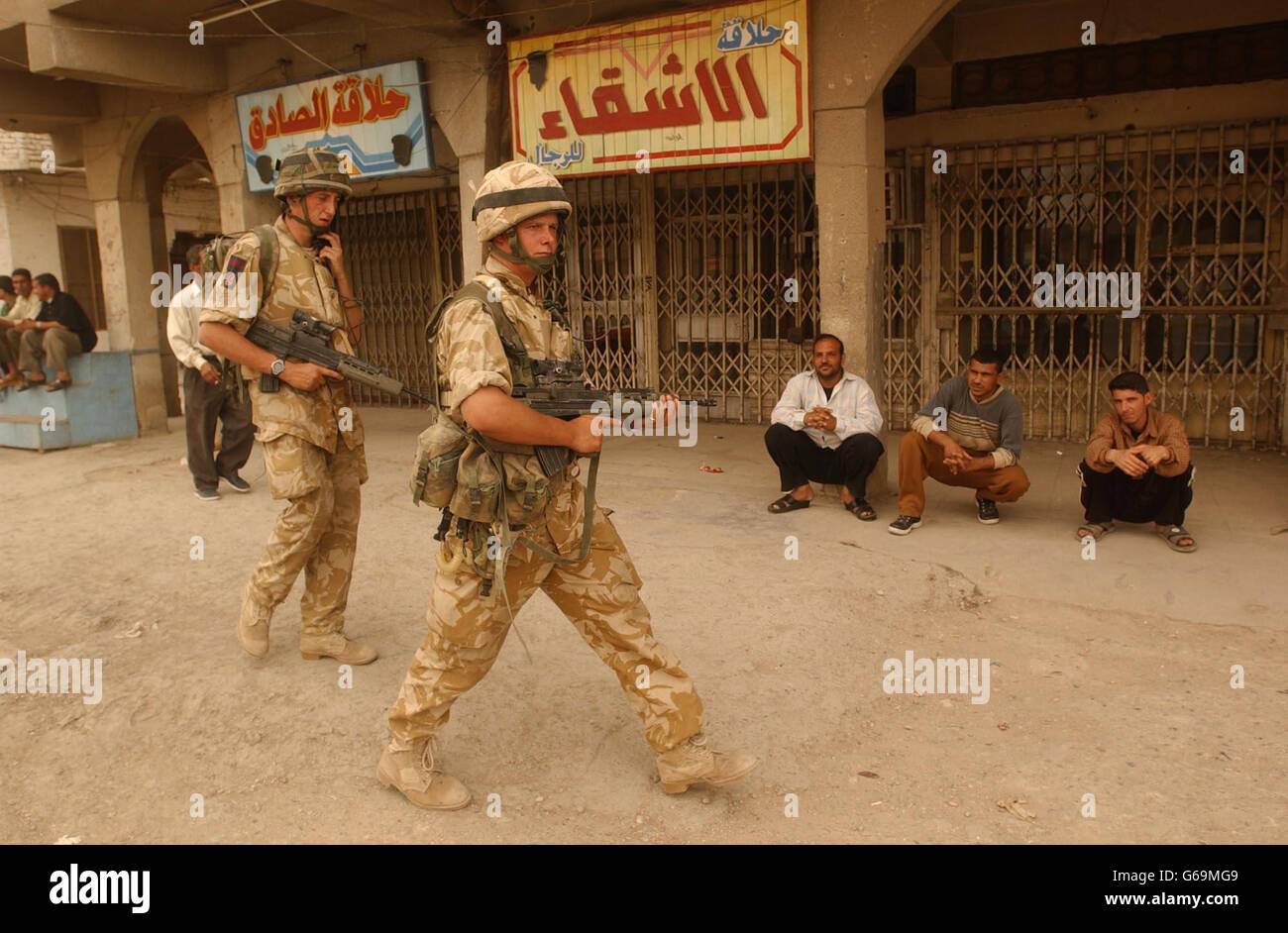 Members of The Irish Guards patrol the streets of Basra, southern Iraq. Stock Photo