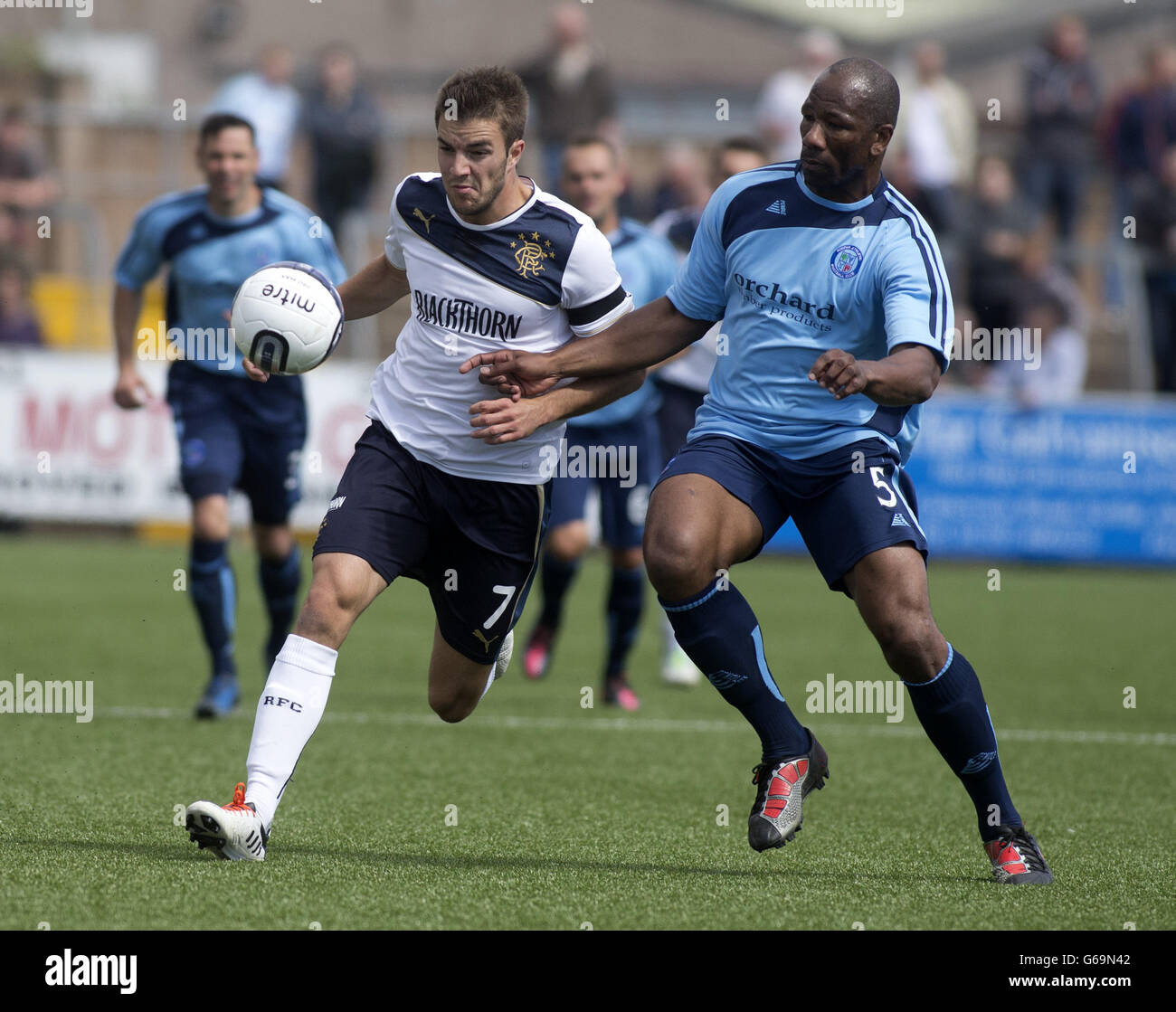 Rangers' Andy Little and Forfar Athletic's Marvin Andrews in action during the Scottish Communities League Cup, First Round match at Station Park, Forfar. Stock Photo