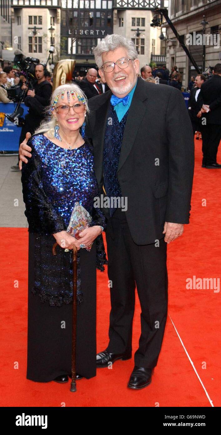 TV presenter Rolf Harris and wife Alwen arriving for the British