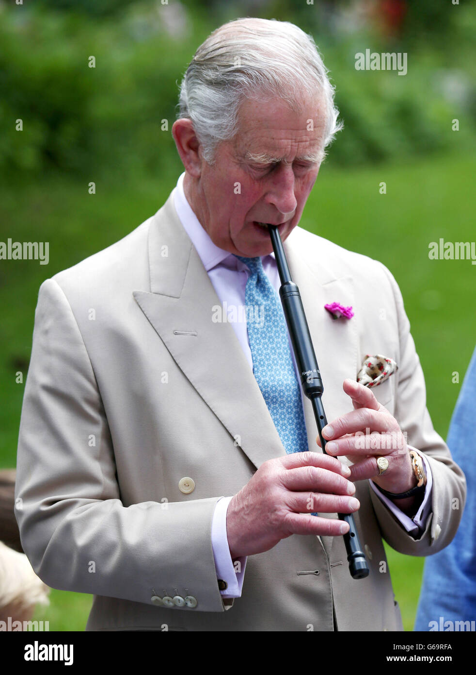 The Prince of Wales, known as the Duke of Rothesay while in Scotland, plays a chanter during his visit to the National Piping Centre at the Dumfries House Estate in Cumnock as it holds a 'Come and Try' workshop. Stock Photo