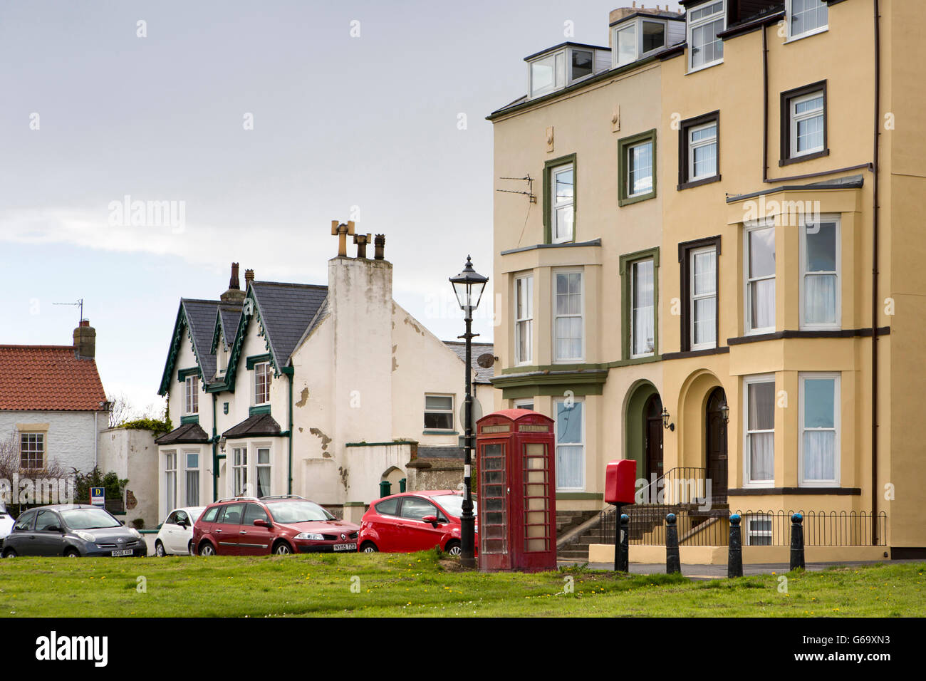 UK, County Durham, Hartlepool, Seaton Carew, houses and K6 phone box around The Green Stock Photo