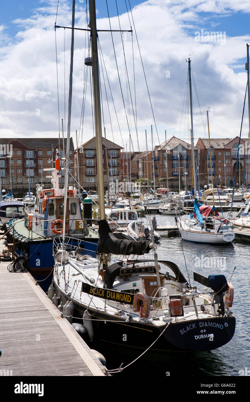 UK, County Durham, Hartlepool, Marina, boats moored beside waterfront housing Stock Photo