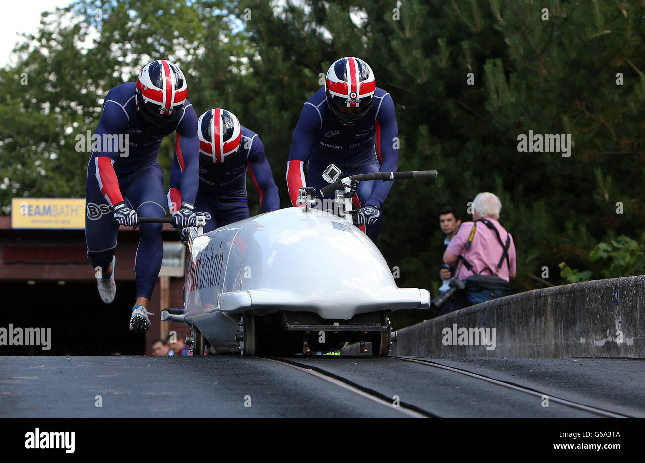 Members of the Great Britain Bobsleigh team practice on the track