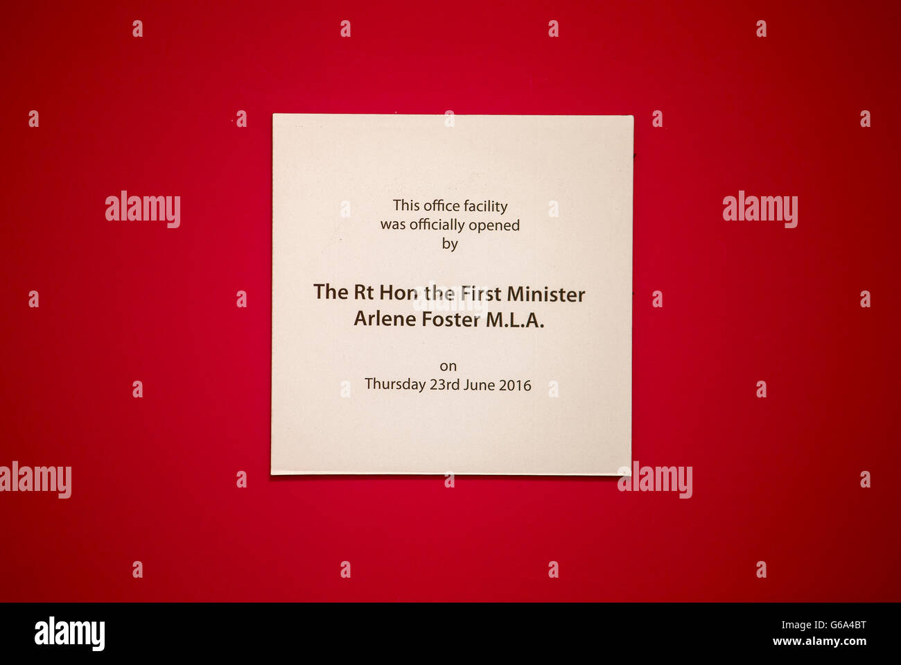 A plaque signifying the opening of the new office facility of Belfast