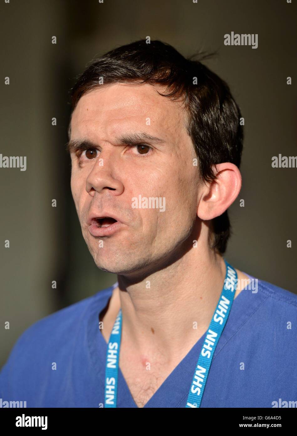Andy Williams, consultant burns and plastic surgeon, speaks to the waiting media outside Chelsea and Westminster Hospital in London where acid attack victims Kirstie Trup and Katie Gee are receiving treatment. Stock Photo