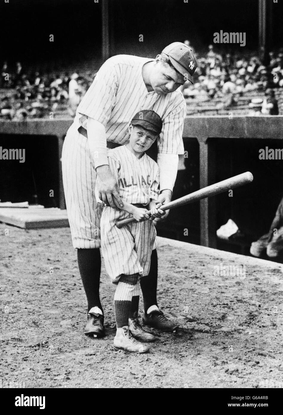 Babe Ruth Holding Baseball Bat by Bettmann