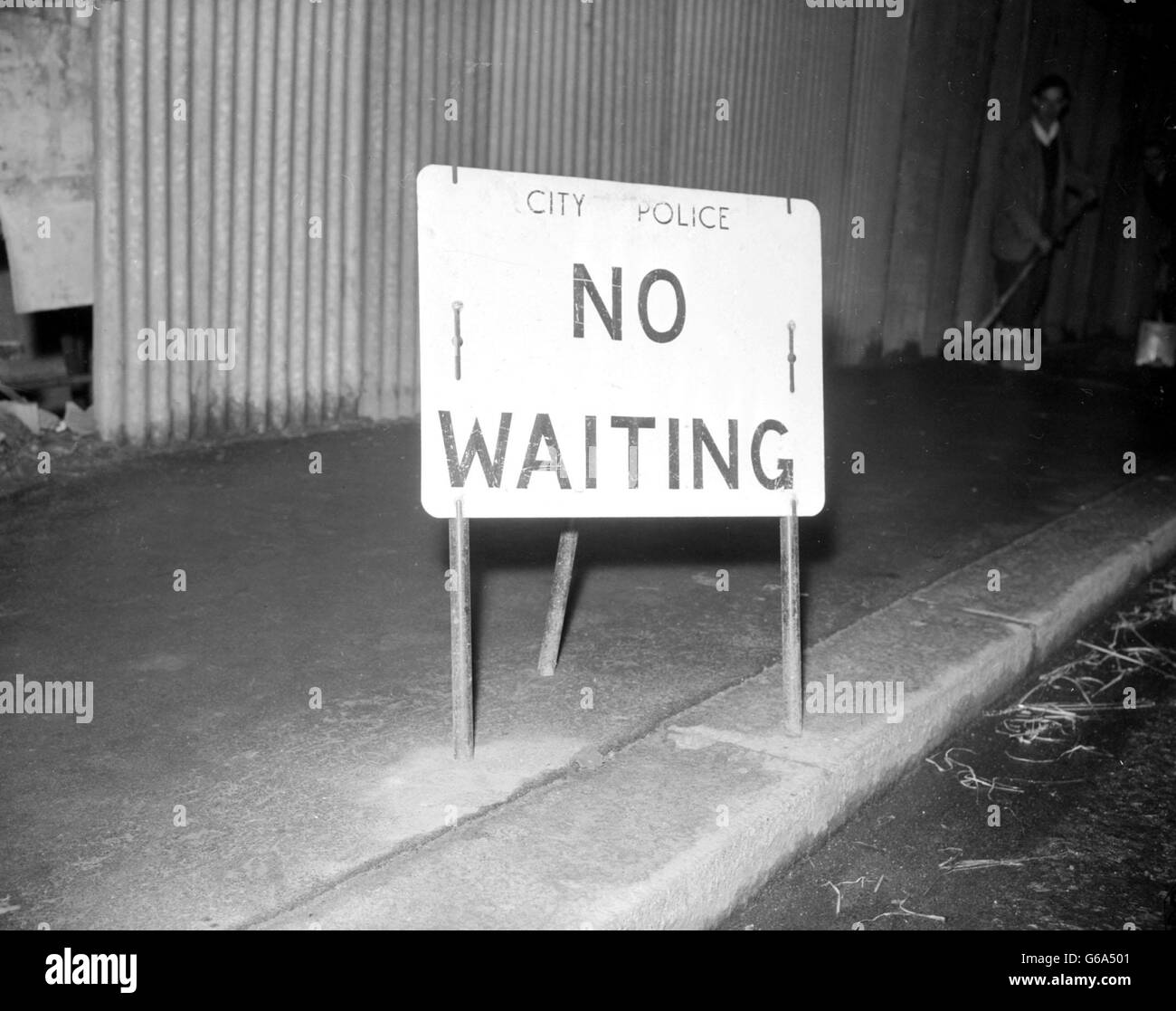 This City Police sign 'No Waiting' is one of the permanent features of the City of London, where the traffic problem is increasing steadily, through increase of cars on the road and lack of parking facilities. Stock Photo