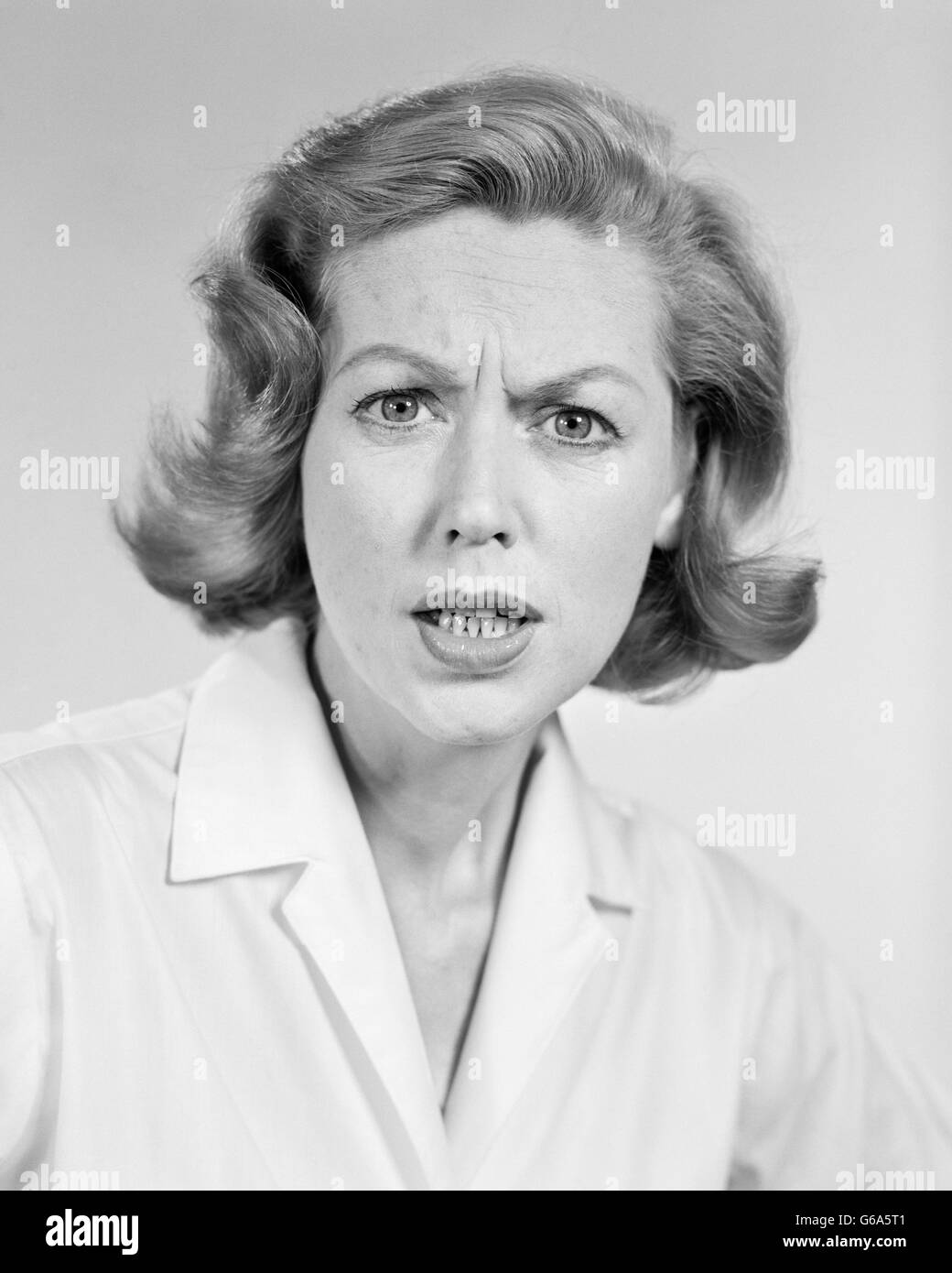 1950s 1960s PORTRAIT WOMAN ANGRY FACIAL EXPRESSION Stock Photo