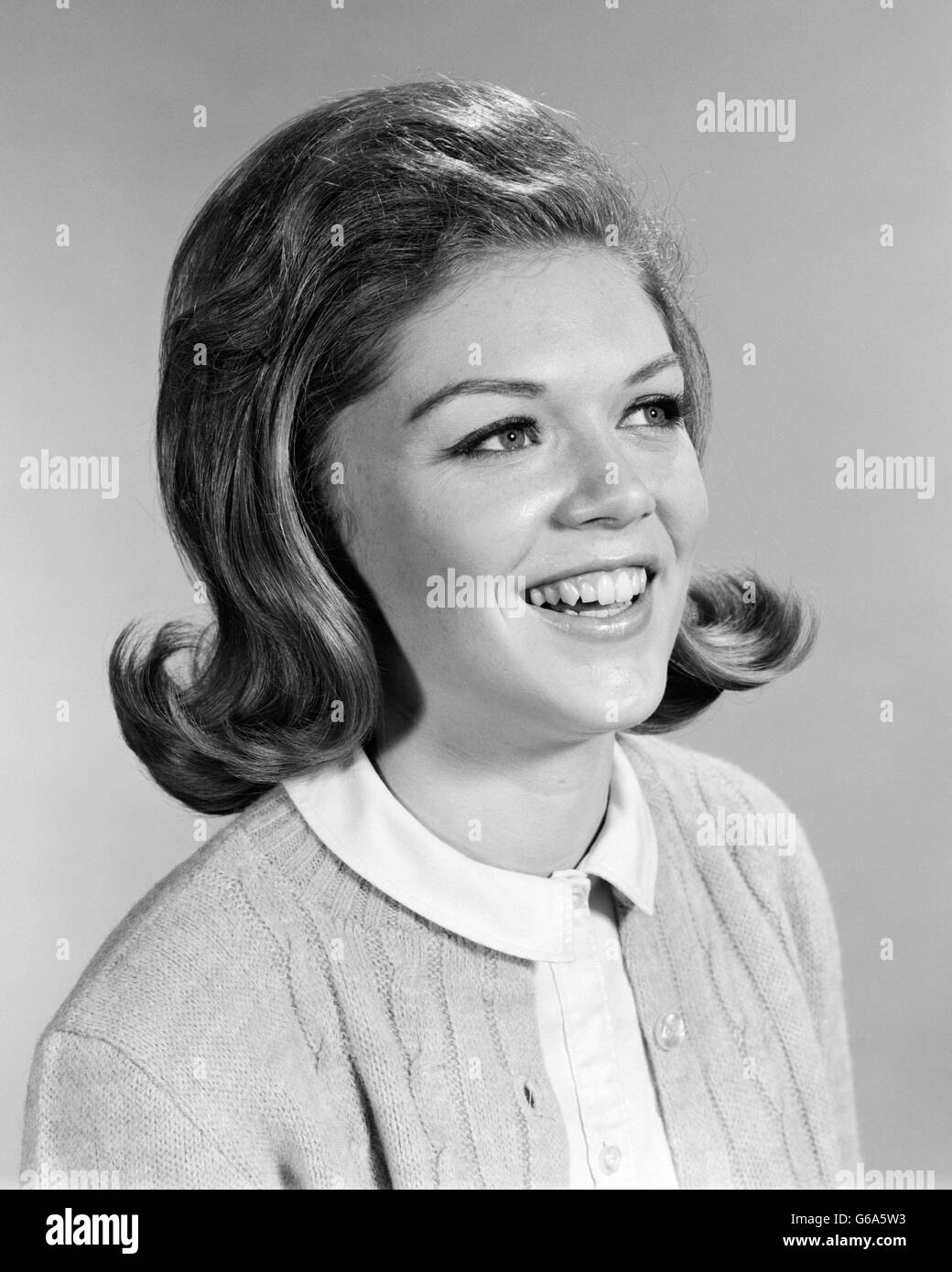 1960s Smiling Woman Portrait With Lightly Teased Flip