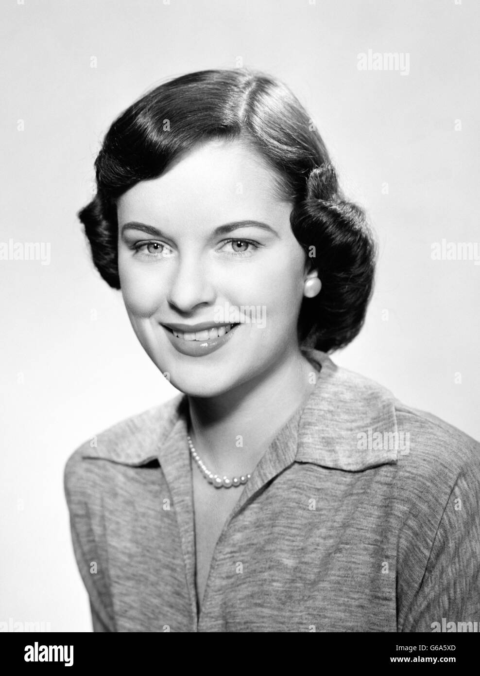 1950s Portrait Smiling Brunette Woman With Page Boy Hairstyle