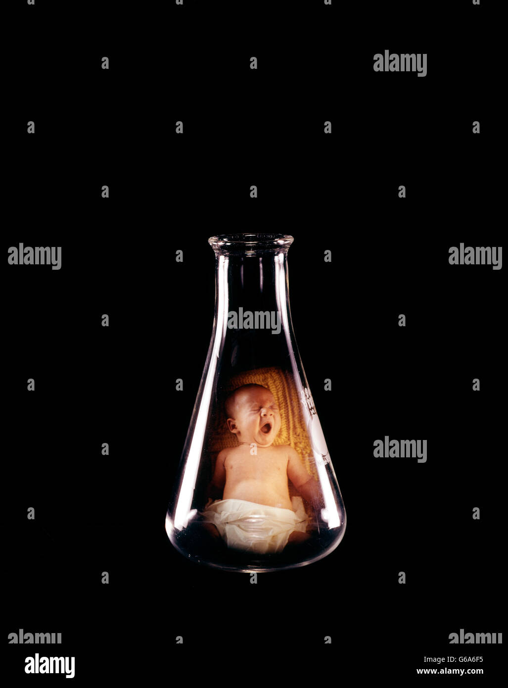 SYMBOLIC TEST TUBE BABY IN CHEMISTRY FLASK Stock Photo