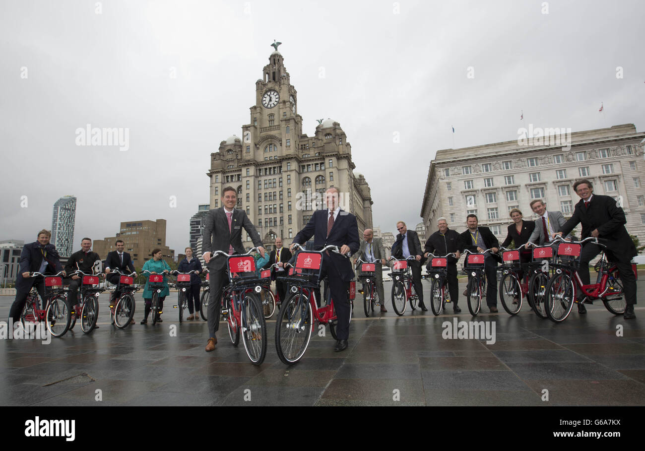 Phillip Darnton, Executive Director of the Bicycle Association, Great Britain (centre right), and Kaj Mook, Director of Abellio Bike & Go (centre left) with guests at the launch of Bike & Go, a nationwide bike hire scheme, at the Liver Building in Liverpool. Stock Photo