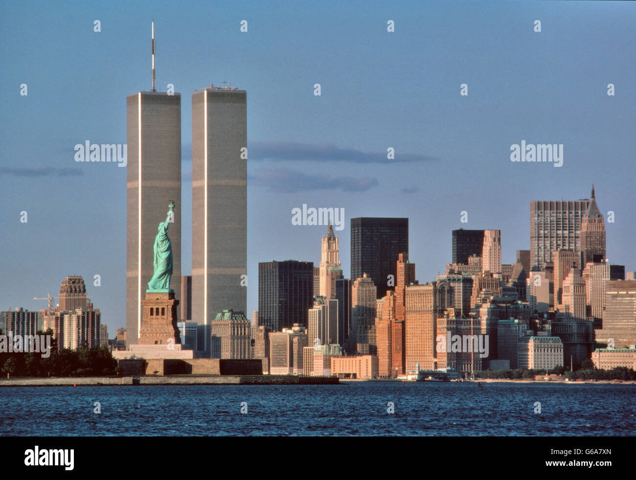 1980s STATUE OF LIBERTY AND TWIN TOWERS OF WORLD TRADE CENTER NEW YORK CITY NY USA Stock Photo