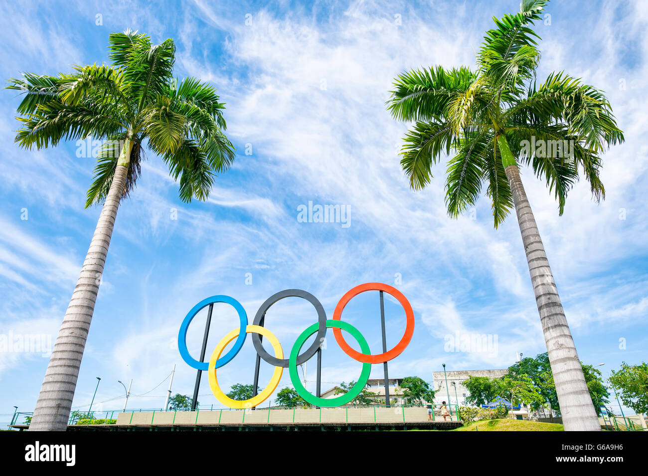 RIO DE JANEIRO - MARCH 18, 2016: Olympic rings stand under tall palm trees in Parque Madureira Park, in the Zona Norte suburbs. Stock Photo
