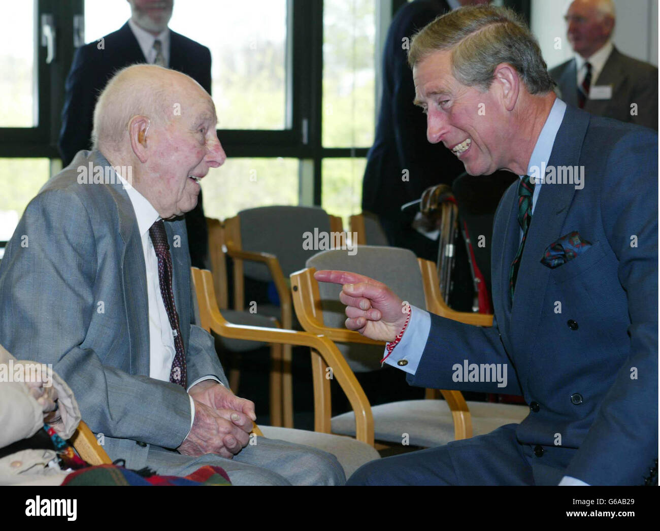 The Prince of Wales shares a joke with First World War veteran Henry Allingham (107), during a visit to the National Archives at Kew. Stock Photo