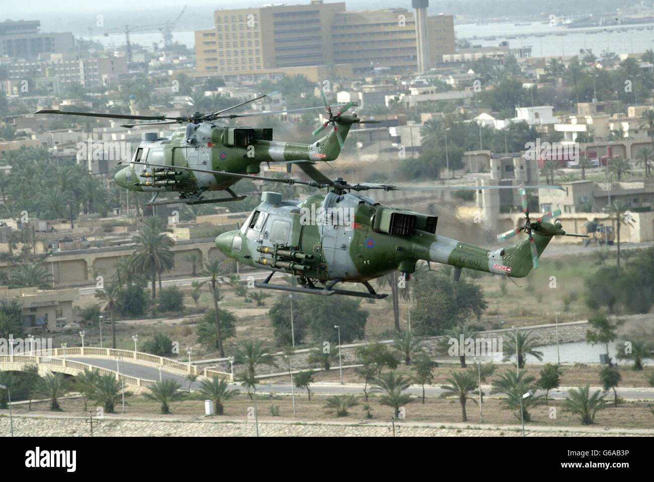 Mk7 Lynx helicopters from 3 Reg Army Air Cops, 16 Assault Brigade on a combat patrol over Basra, Iraq, loaded with Tow missiles. Stock Photo