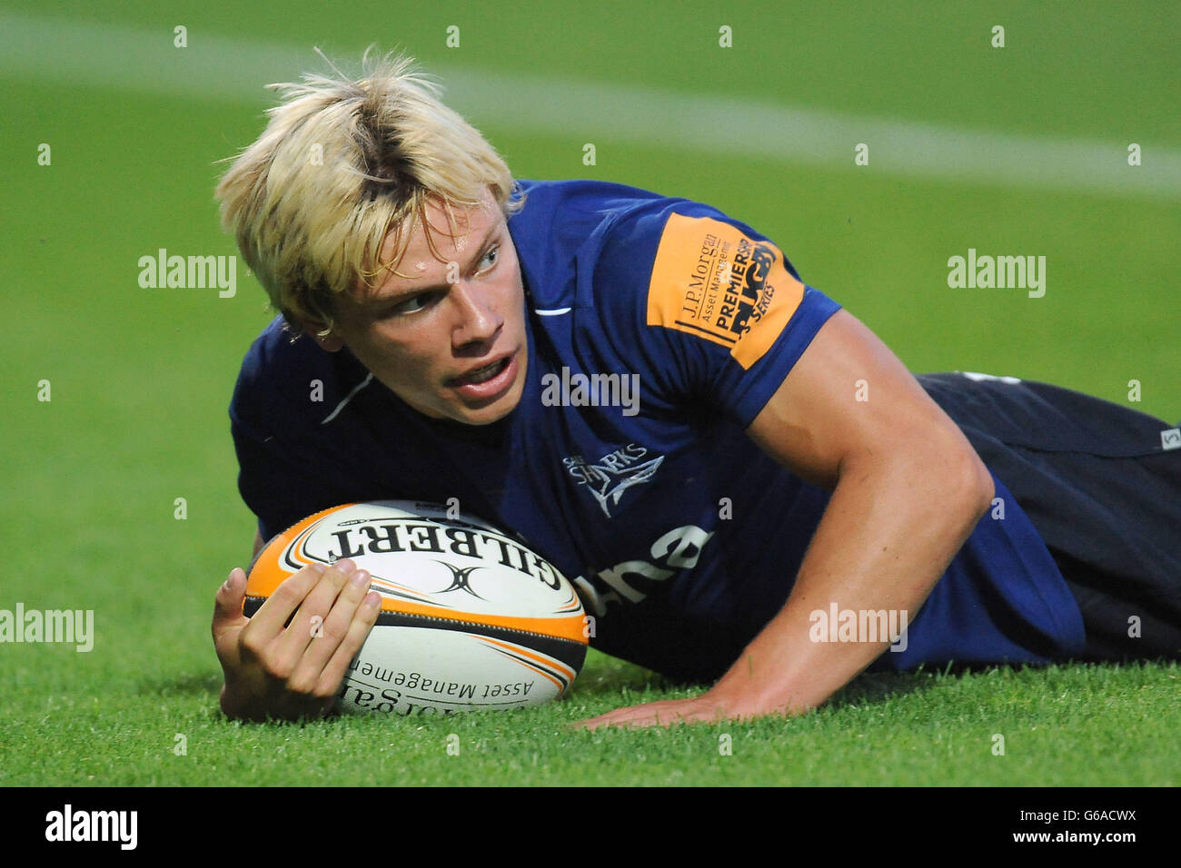 Sale Sharks 7s Nathan Fowles dives in to score against Northampton Saints 7s during the Group B match of the J.P. Morgan Asset Management Premiership Rugby 7's at Franklin's Gardens, Northampton. Stock Photo