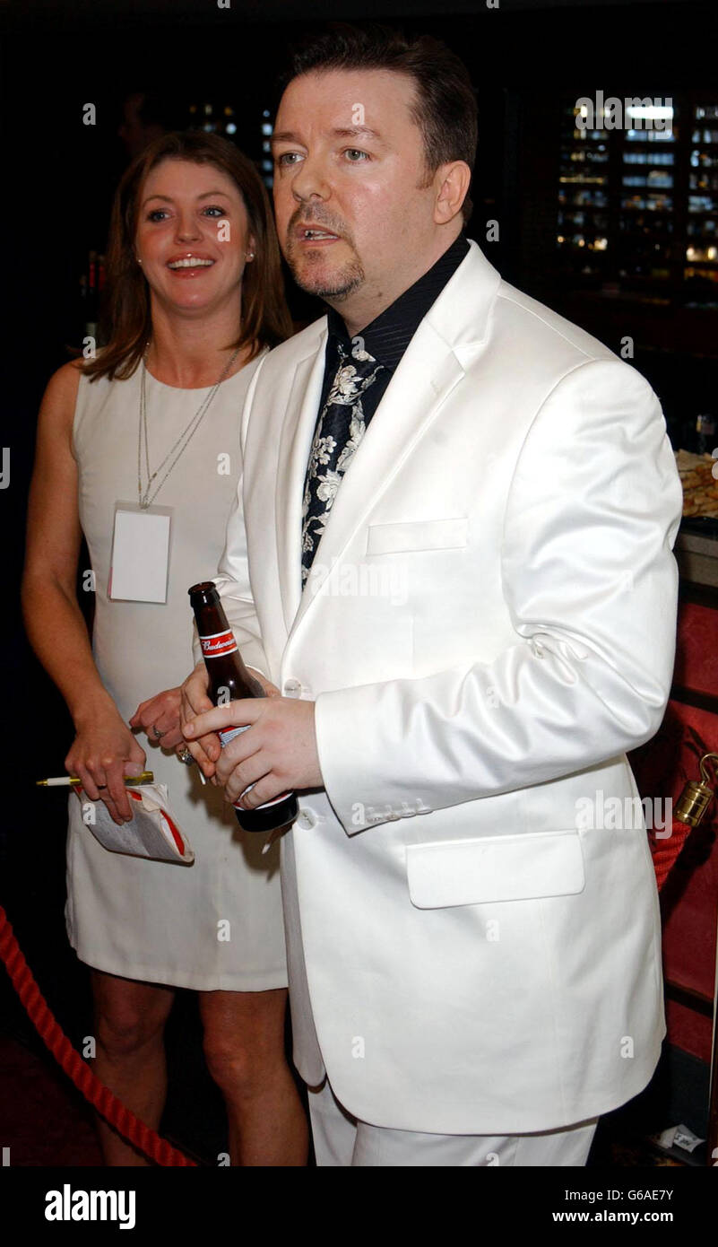 Celebrity 1 2 half length actor white suit beer bottle hi-res stock