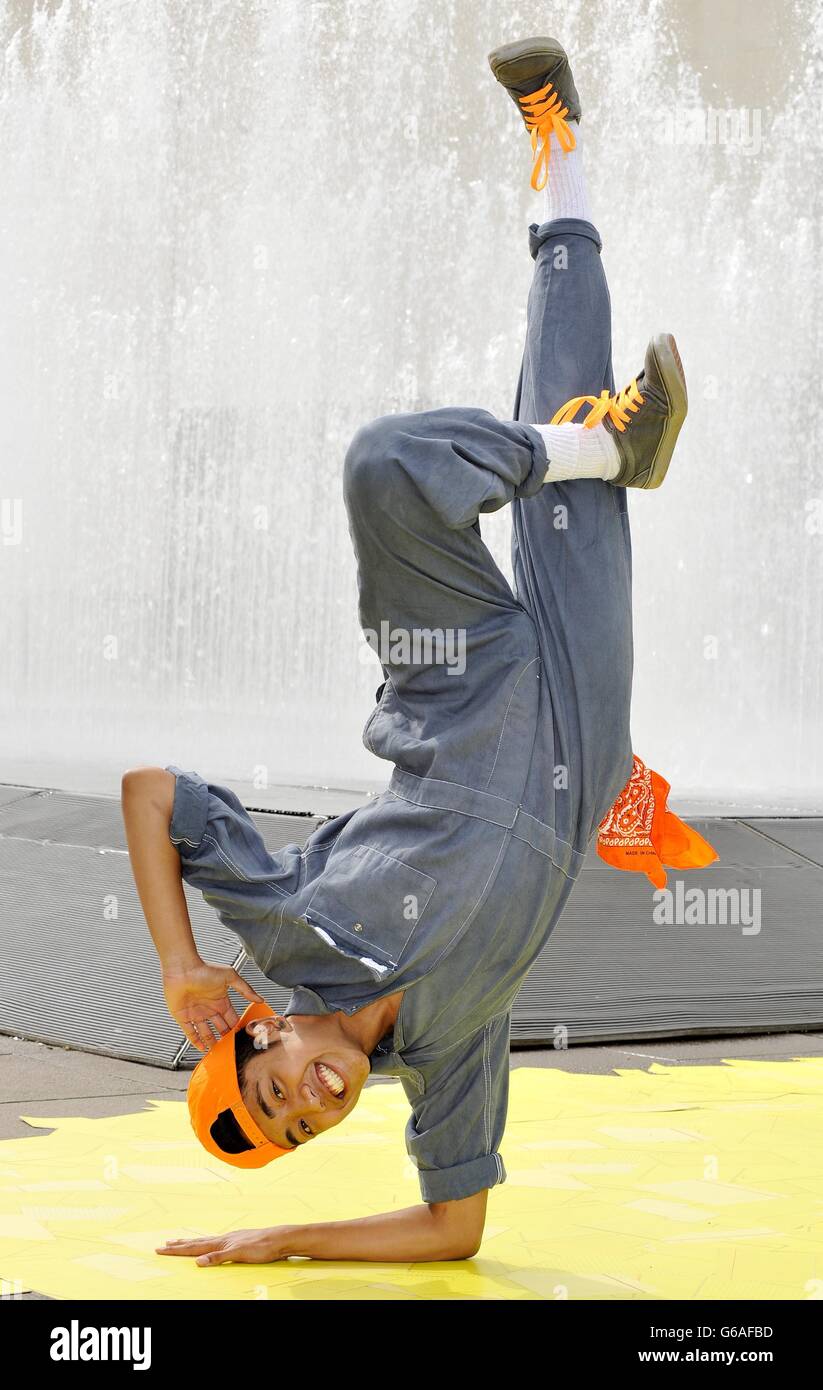 Michael Ureta, as the Tin Man, a member of ZooNation dance company performs during a photocall on the Southbank, south London, to mark the company's return to the Southbank Centre, with the premiere of Groove on Down the Road, a hip hop take on the Wizard of Oz story, which runs from August 10 - 31. Stock Photo
