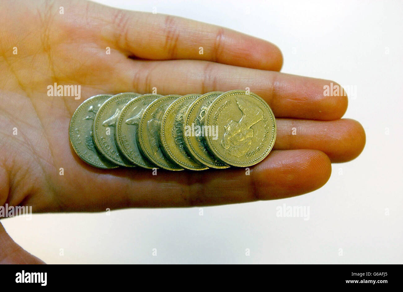 Stock picture of English One Pound Coins. 29/7/04: The Bank of England will release figures showing consumers now collectively owe more than 1 trillion. The money is owed through a combination of mortgages, personal loans, overdrafts, hire purchase agreements and on credit and store cards. Stock Photo