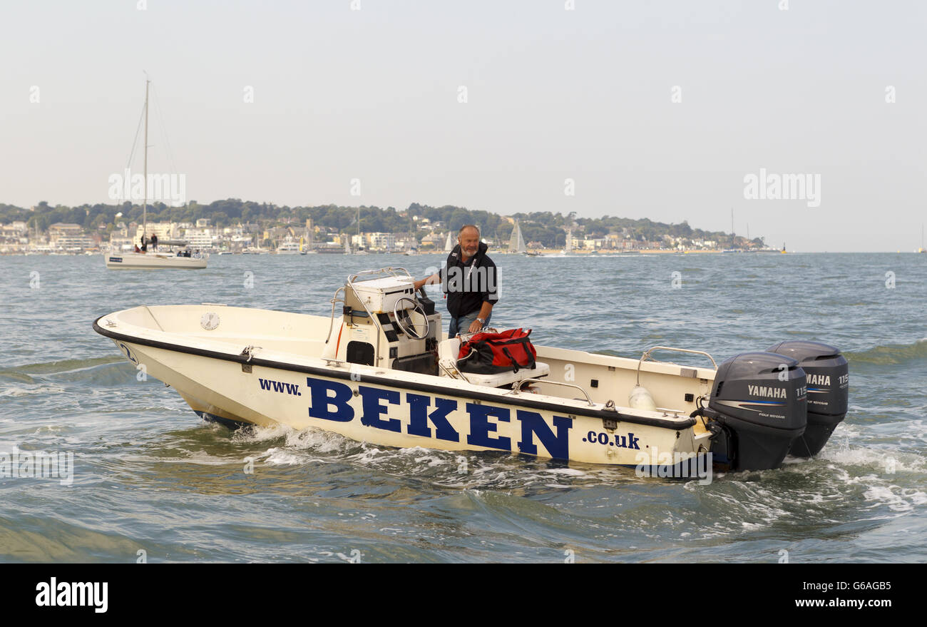Photographer Peter Mumford of the world famous Beken of Cowes family aboard his Boston Whaler boat at Aberdeen Asset Management Cowes Week. Stock Photo
