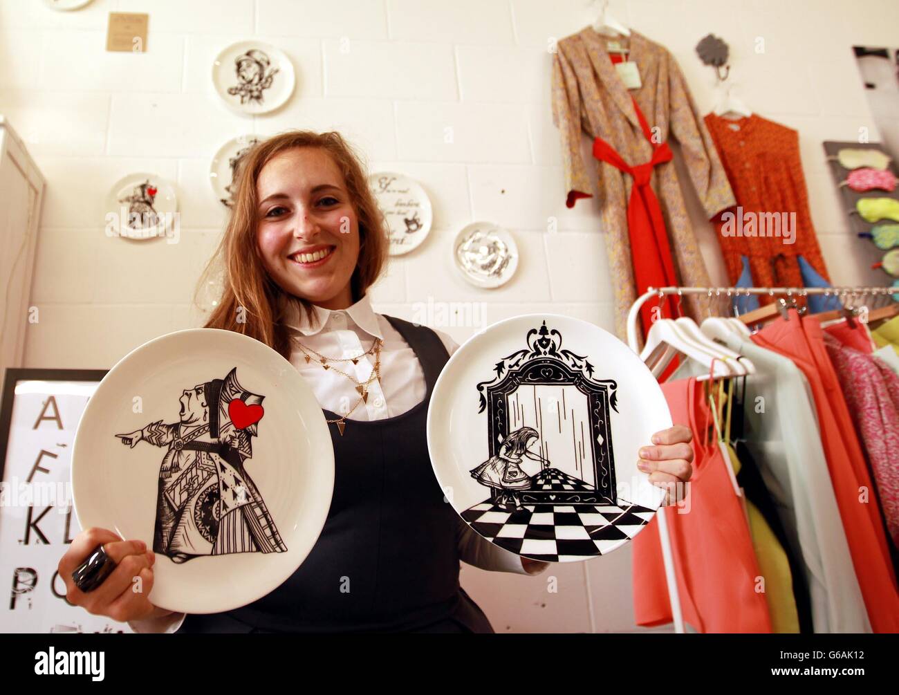 Designer Eleanor Stuart with her Alice in Wonderland inspired plates made in Stoke-On-Trent in the pop-up shop that has opened, in a property in central London owned by the Crown Estate, in a bid to help entrepreneurs of the future. Stock Photo