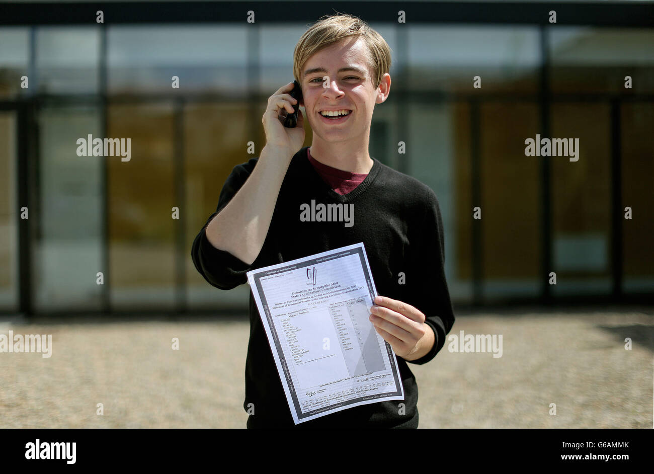 Mark Berney at Gorey Community College, County Wexford holding a copy of his Leaving Cert results with 9 A1s printed on it. Stock Photo