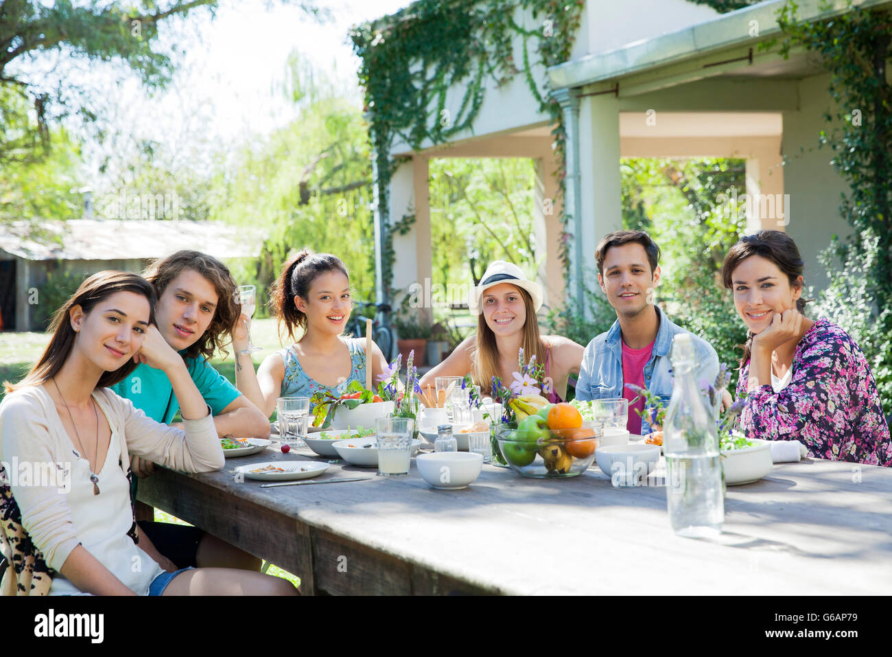 Friends having meal together, portrait Stock Photo