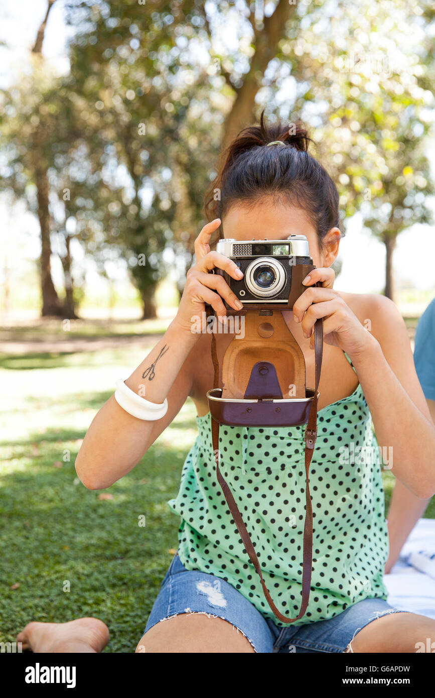 Woman taking picture, personal perspective Stock Photo