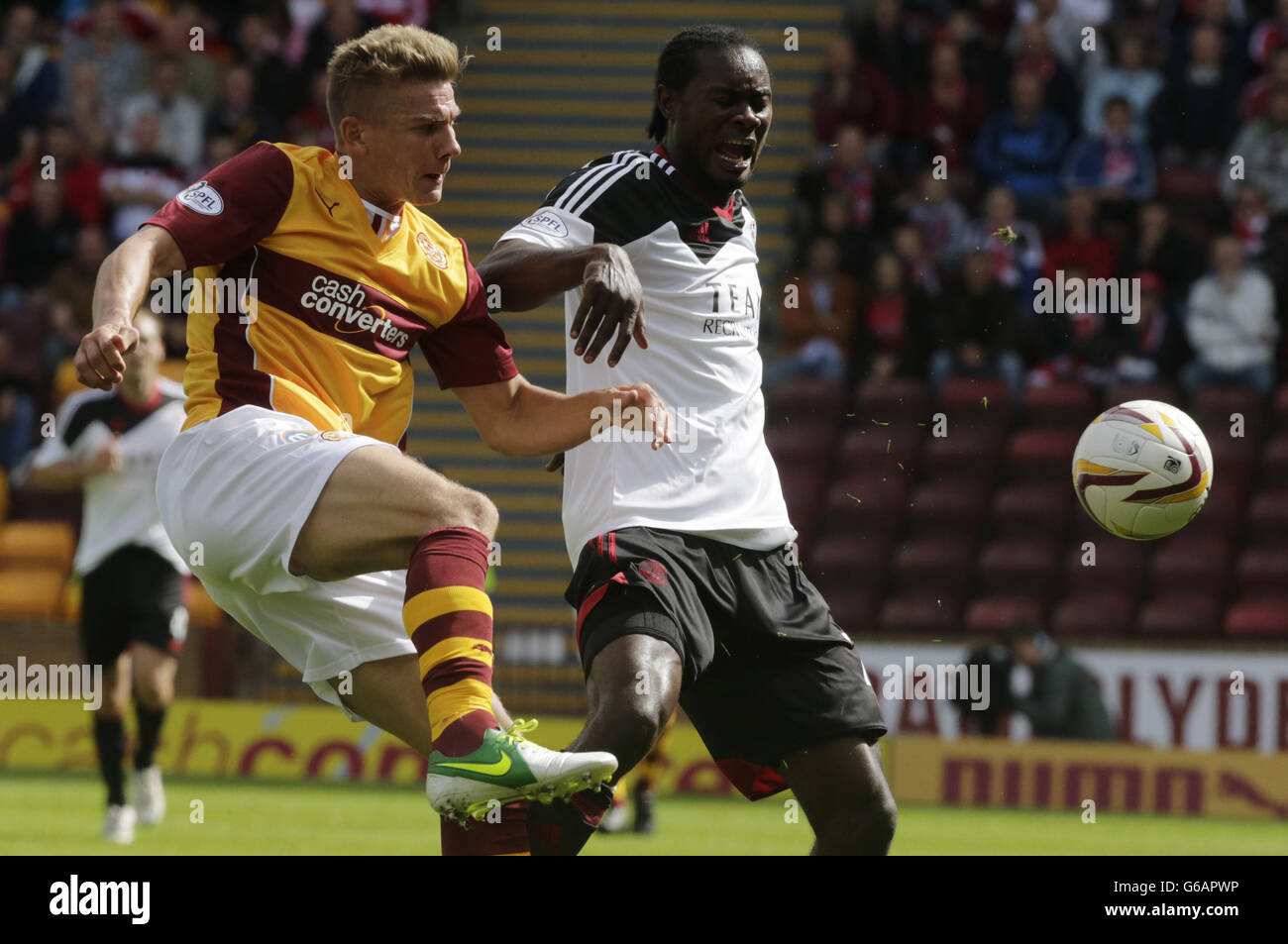 Motherwell's Shaun Hutchinson and Aberdeen's Calvin Zola fight for the ball during the Scottish Premiership match at Fir Park, Motherwell. Stock Photo
