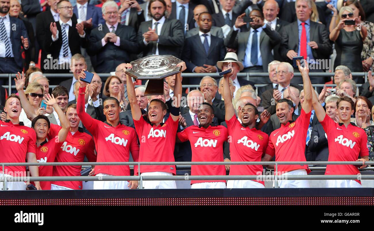 Manchester United's captain Nemanja Vidic lifts the FA Community Shield trophy Stock Photo