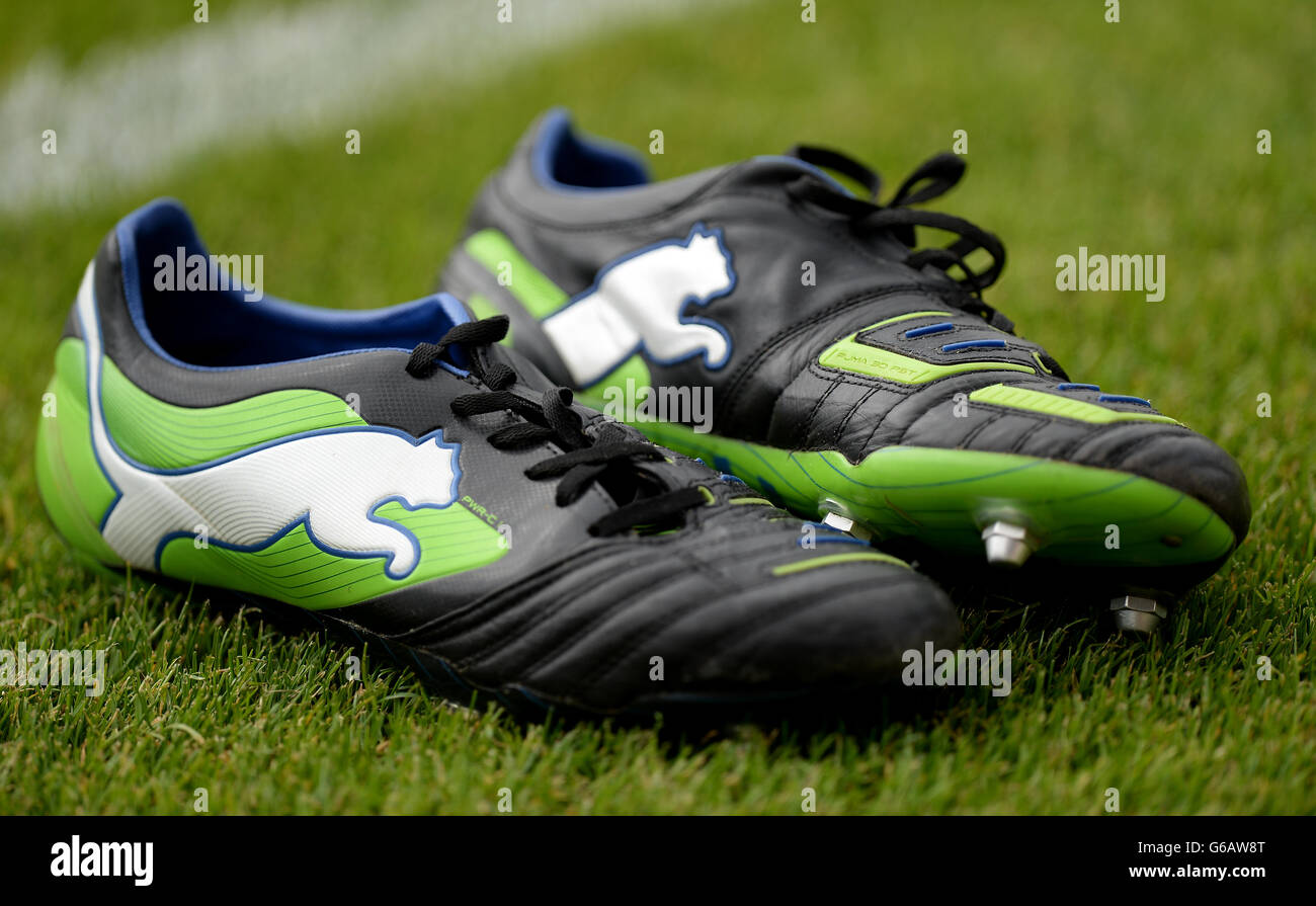 General view of a pair of Puma football boots on the side of the pitch  Stock Photo - Alamy