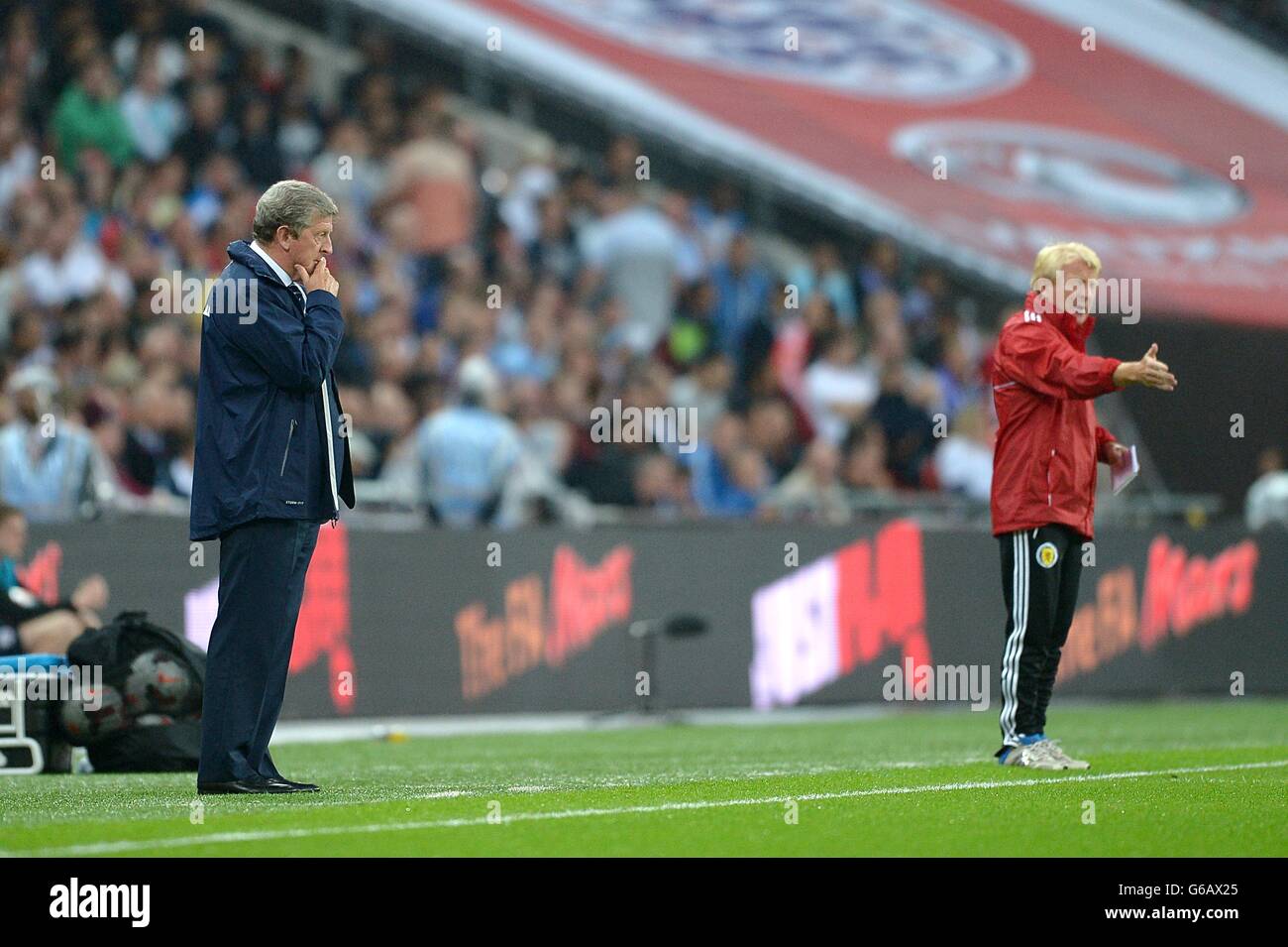 England manager Roy Hodgson (left) and Scotland manager Gordon Strachan on the touchline Stock Photo