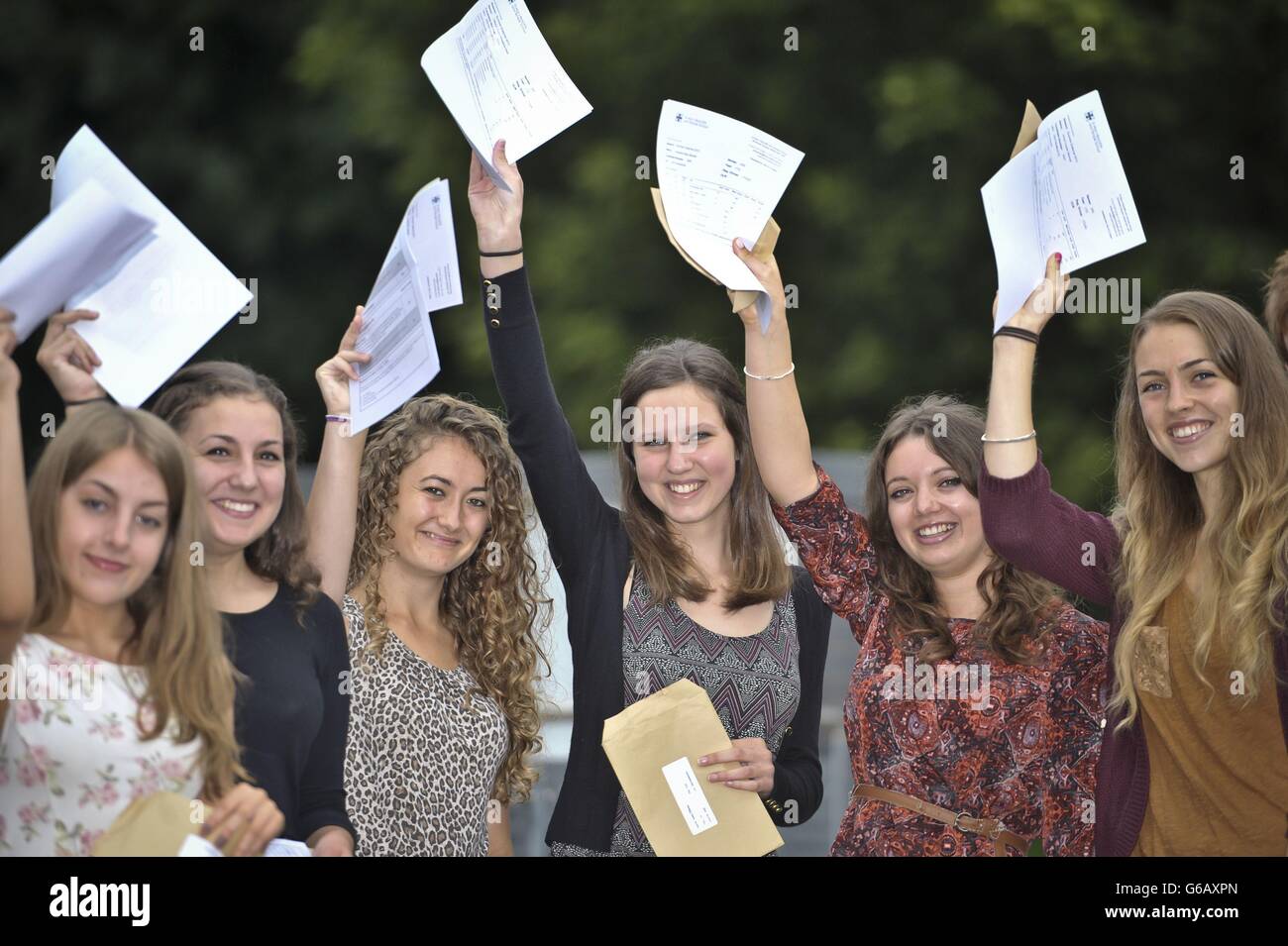 Top achieving A* students at St Mary Redcliffe and Temple School pupils wave their their A-Level results in the air. Stock Photo