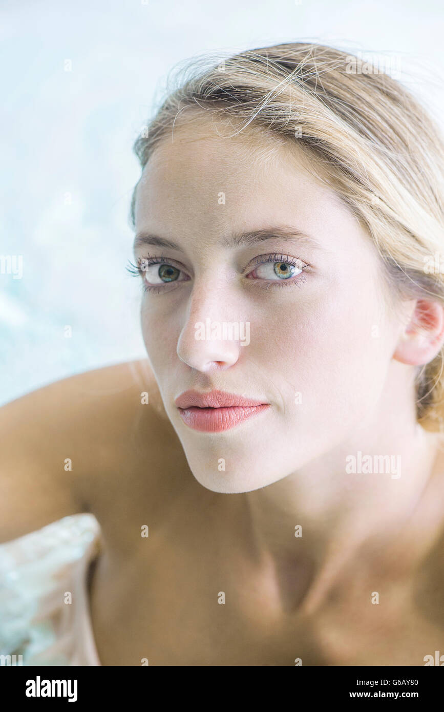 Woman soaking in spa, portrait Stock Photo