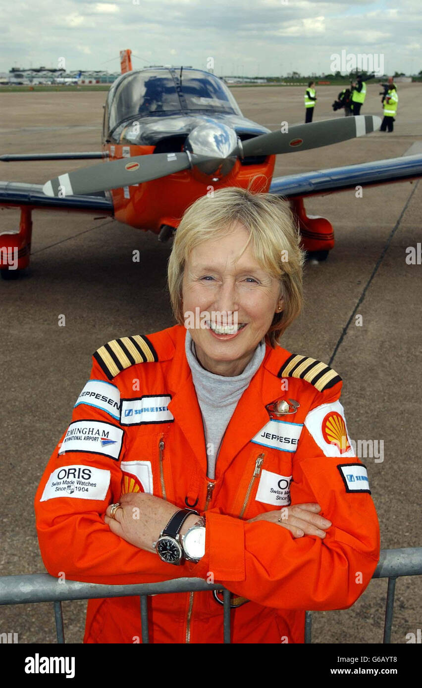 Polly Vacher and her Piper Dakota single engined plane before setting off from Birmingham International Airport, on her Trans Polar solo circumnavigation of the world. 27/04/04: Polly Vacher and her Piper Dakota single engined plane. The 60-year-old pilot who attempted to become the first to fly solo around the world via both Poles in a single engine aircraft was touching down back in Britain Tuesday April 27, 2004, more than a year after she took off. The retired music teacherwill land at Birmingham International Airport 357 days after she climbed aboard her Piper Dakota for the epic Voyage Stock Photo