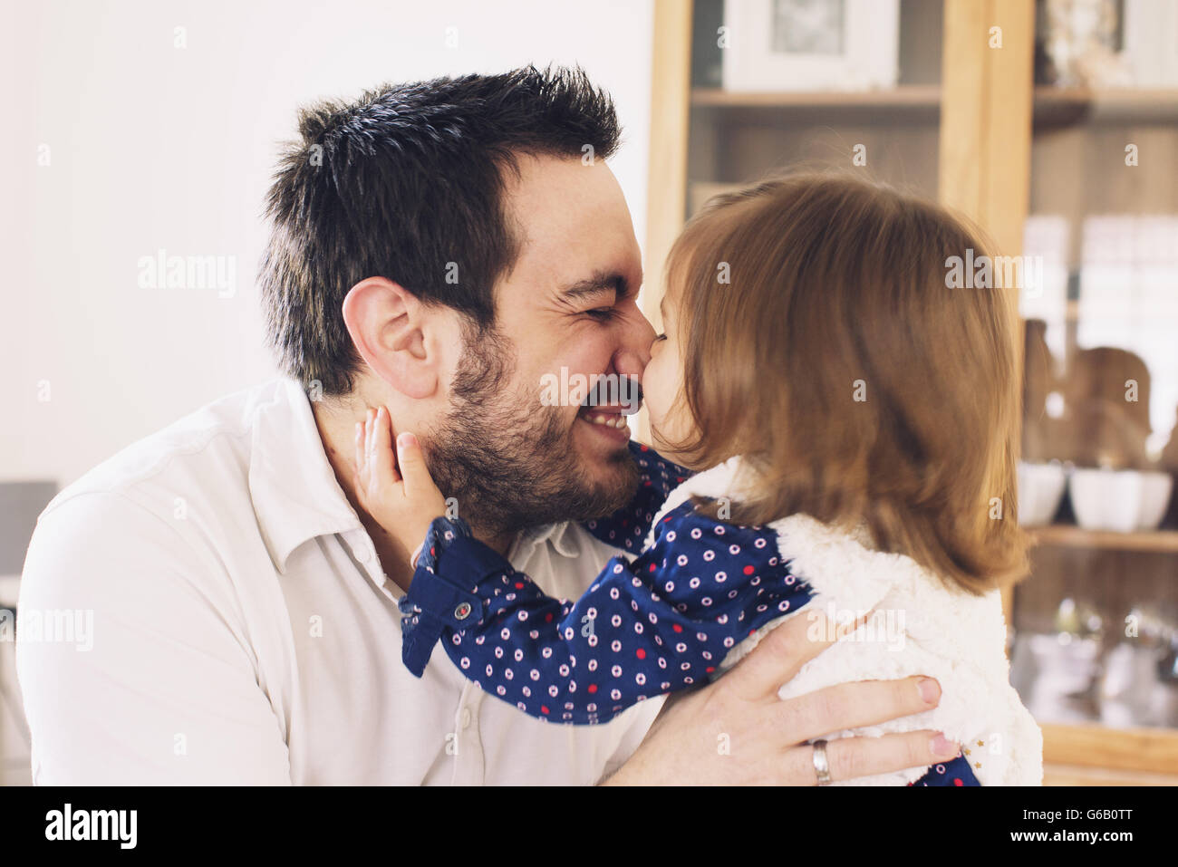 Father and daughter rubbing noses Stock Photo