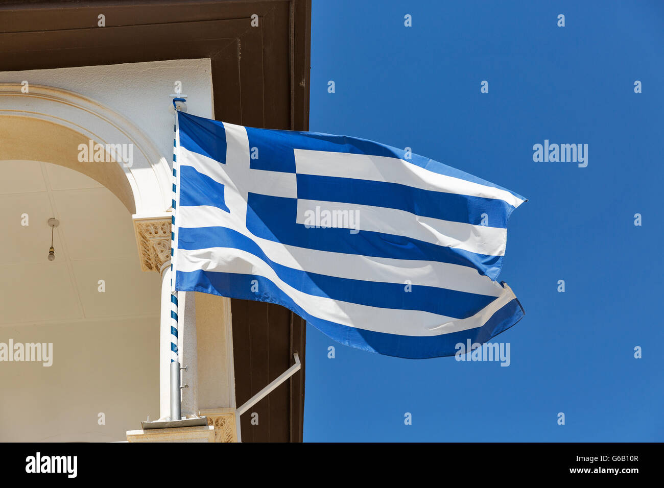 Greek national flag closeup on church in Paphos, Cyprus. Stock Photo