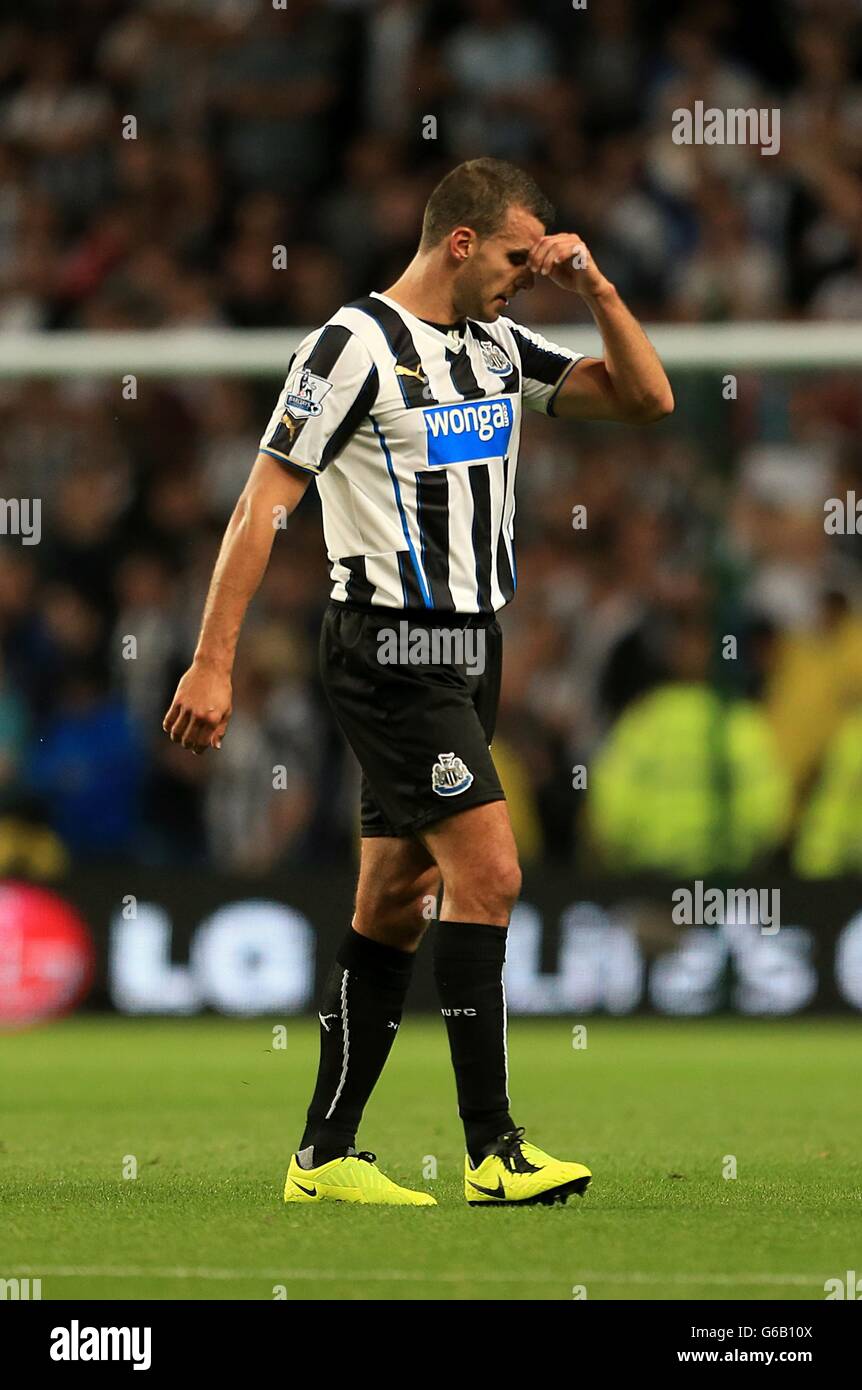 Newcastle United's Steven Taylor leaves the pitch after being sent-off by match referee Andre Marriner (not in picture) after fouling Manchester City's Sergio Aguero (not in picture) Stock Photo